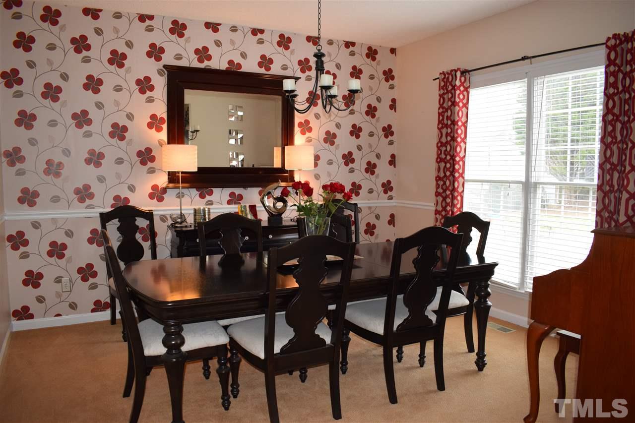 5200 Calverton Drive Raleigh, NC 27613 - Photo 10 of 25 Living room is currently being used as a dining room.