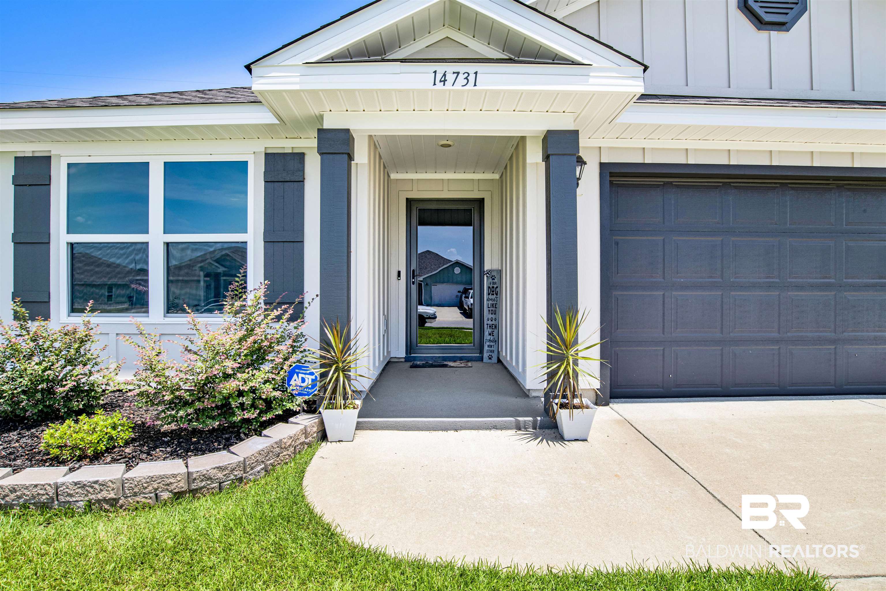 14731 Forsythia Loop Silverhill, AL 36576 - Photo 2 of 25 Doorway to property featuring a garage