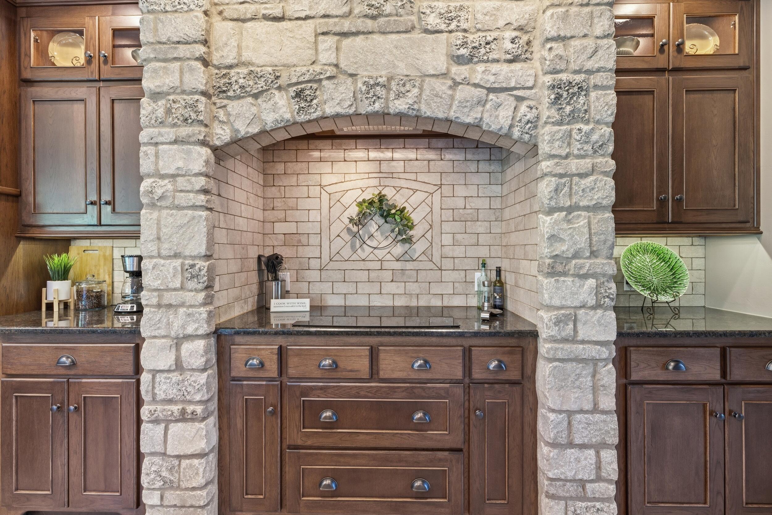 11105 Meadow Ridge Road Whitelaw, WI 54247 - Photo 23 of 78 Stone Cooktop Hearth with Venting and Overhead Light