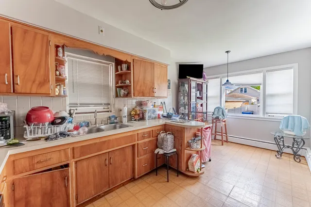 a kitchen with a sink counter top space and appliances