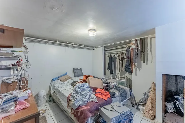 a bedroom with bed and a window