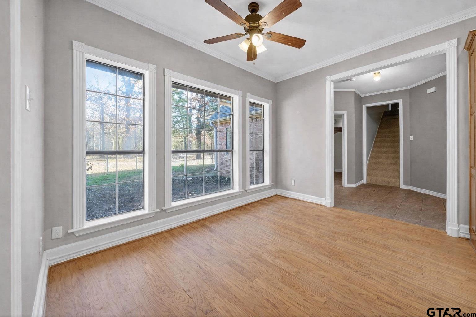 781 Highway 19 Edgewood, TX 75117 - Photo 13 of 48 a view of an empty room with a window and wooden floor