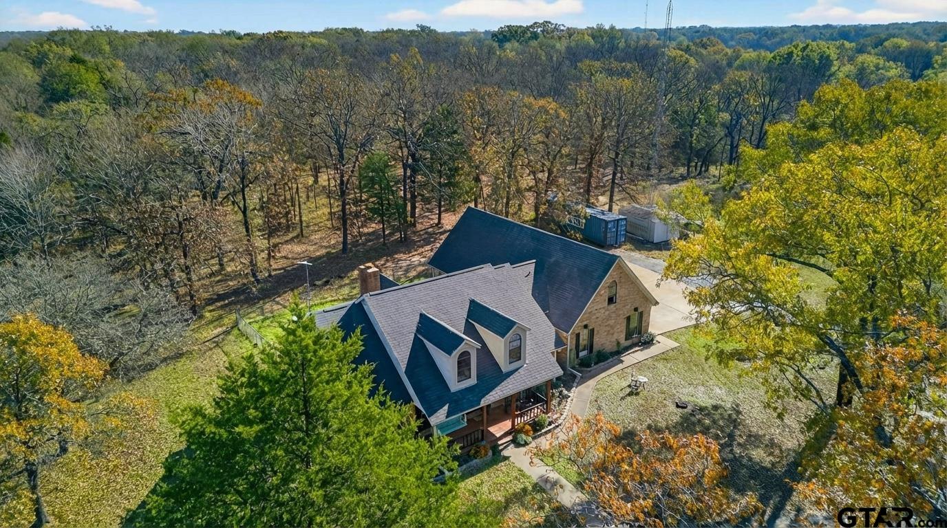781 Highway 19 Edgewood, TX 75117 - Photo 2 of 48 an aerial view of a house with a yard