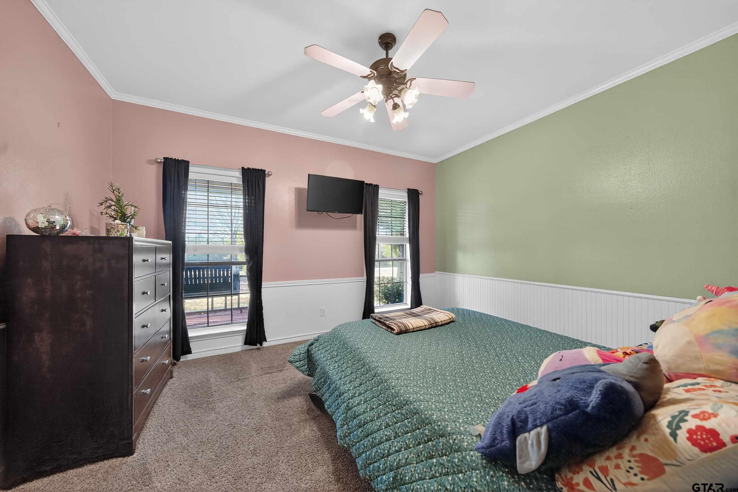 781 Highway 19 Edgewood, TX 75117 - Photo 22 of 48 a bedroom with a bed and a chandelier