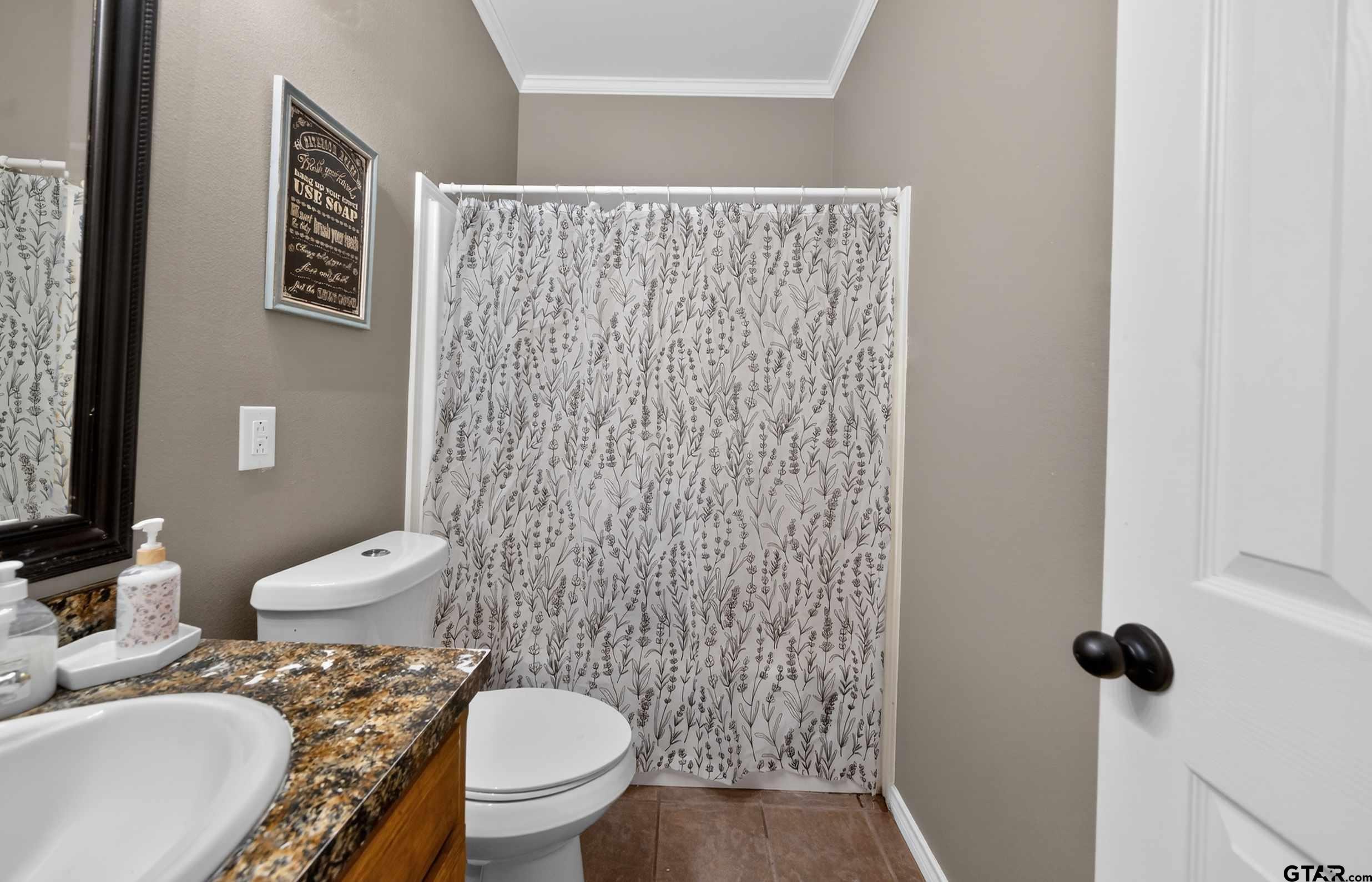 781 Highway 19 Edgewood, TX 75117 - Photo 25 of 48 a bathroom with a toilet and a sink