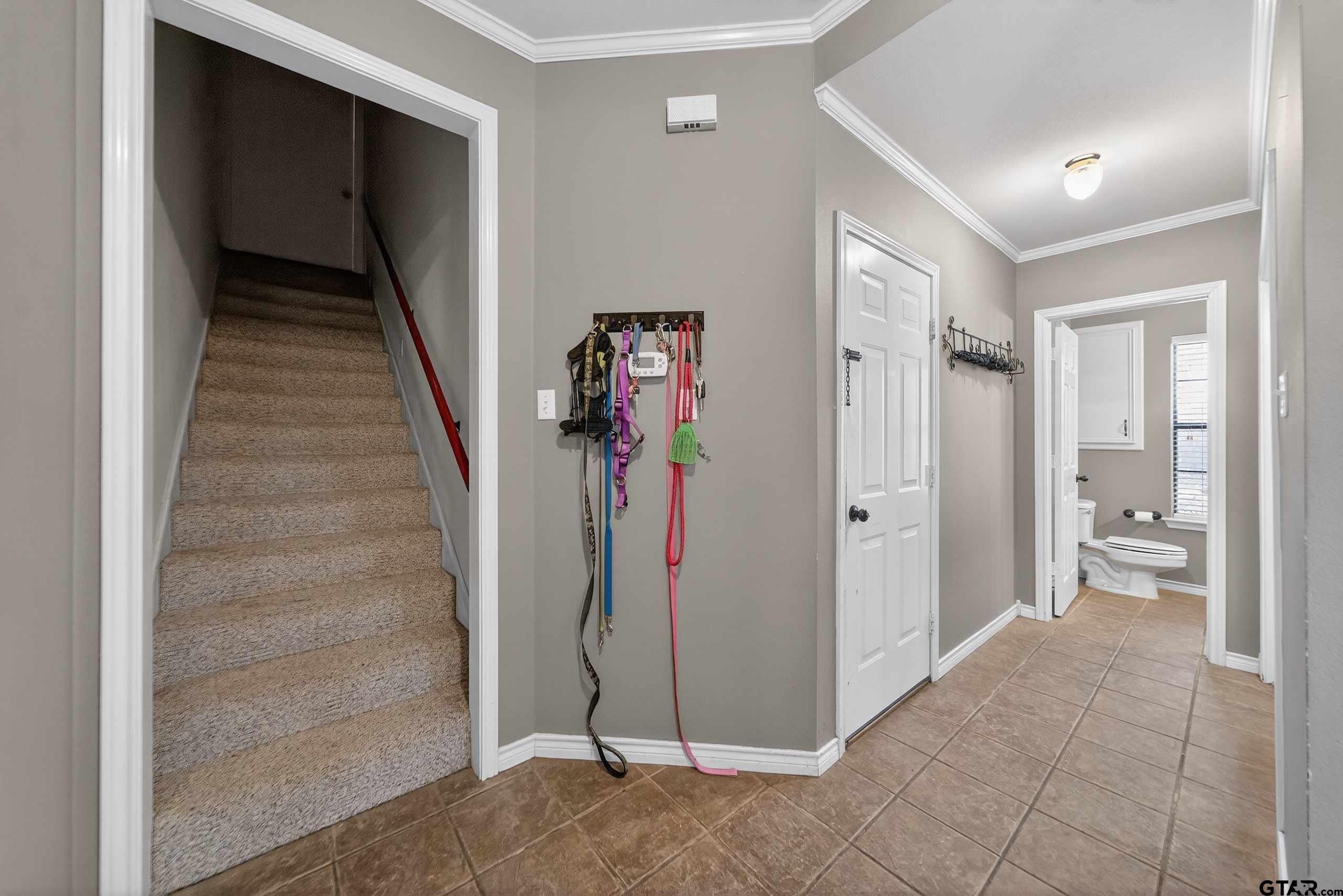 781 Highway 19 Edgewood, TX 75117 - Photo 26 of 48 a view of a hallway with bathroom and wooden floor