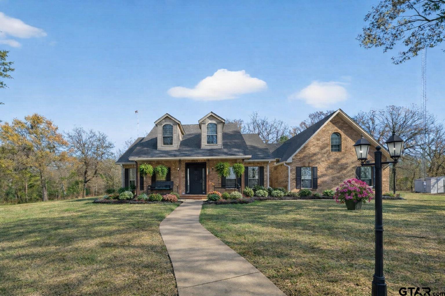 781 Highway 19 Edgewood, TX 75117 - Photo 3 of 48 a front view of a house with a yard