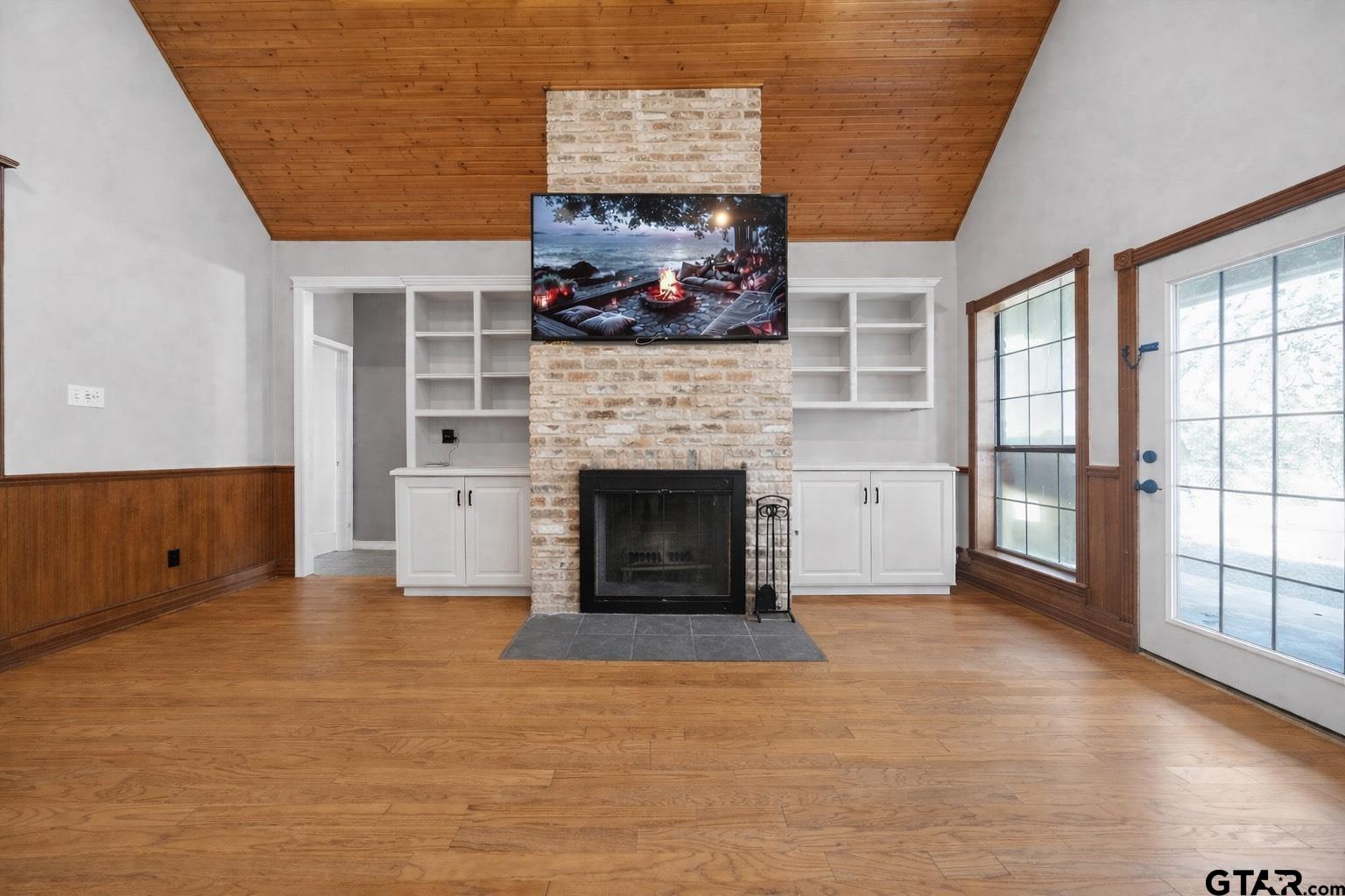 781 Highway 19 Edgewood, TX 75117 - Photo 7 of 48 a view of an empty room with a fireplace and a window
