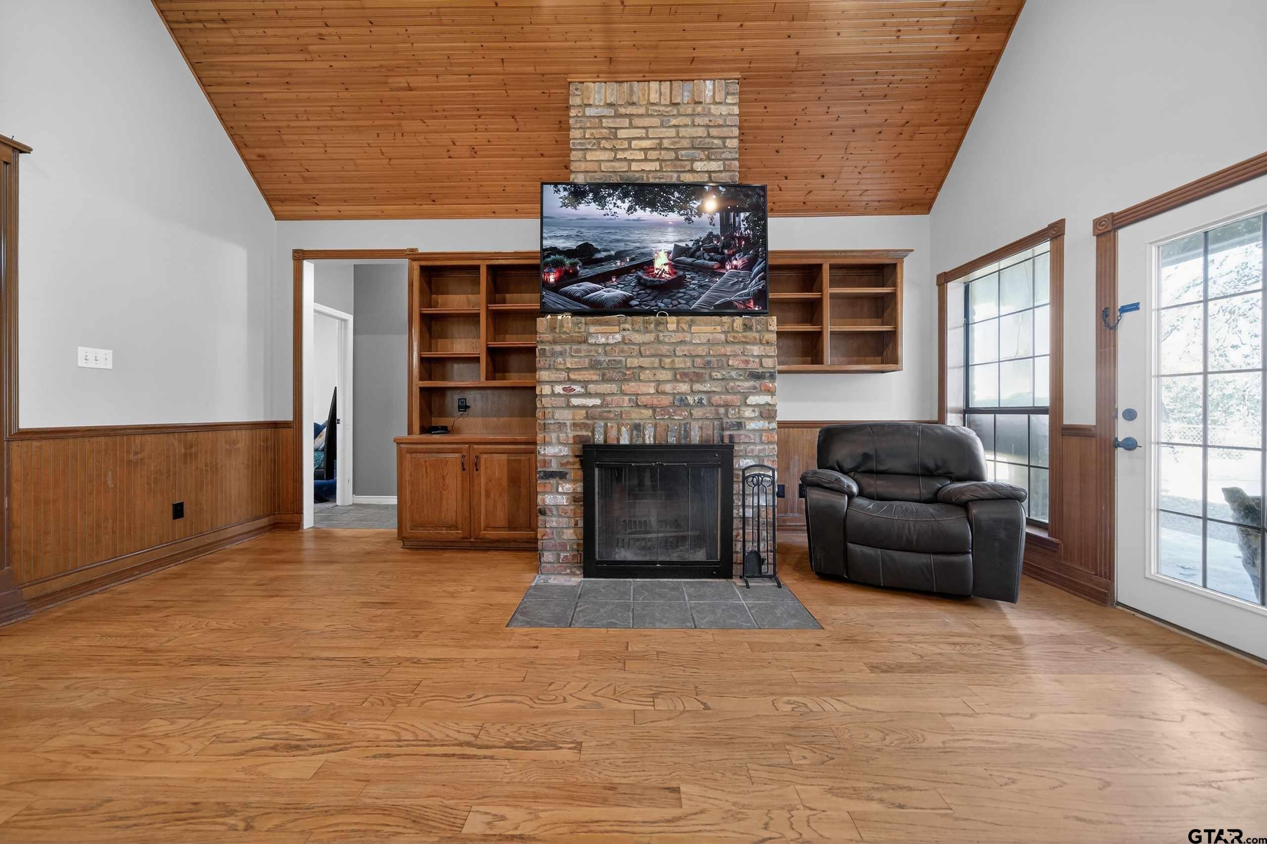 781 Highway 19 Edgewood, TX 75117 - Photo 8 of 48 a living room with furniture and a fireplace