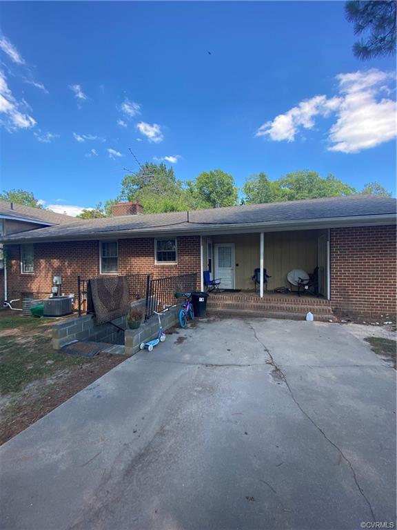 241 Nottoway Falls Road Kenbridge, VA 23944 - Photo 11 of 29 a view of a house with a patio and a yard