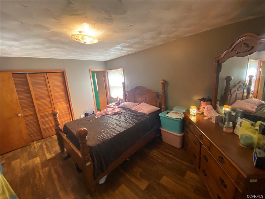 241 Nottoway Falls Road Kenbridge, VA 23944 - Photo 16 of 29 a bedroom with a bed and wooden floor