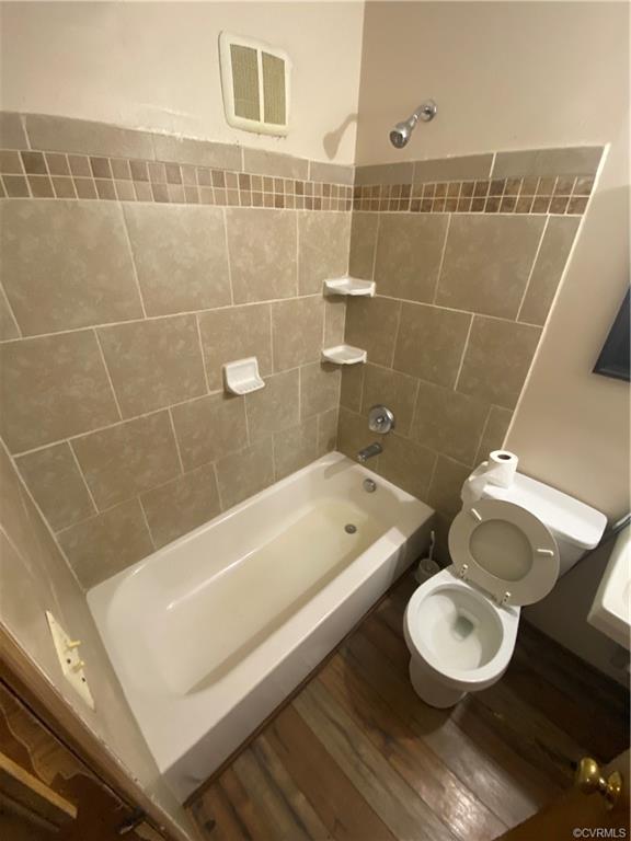 241 Nottoway Falls Road Kenbridge, VA 23944 - Photo 23 of 29 a bathroom with a toilet a sink and bathtub