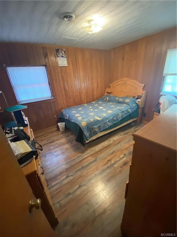 241 Nottoway Falls Road Kenbridge, VA 23944 - Photo 25 of 29 a bedroom with a bed and a night stand