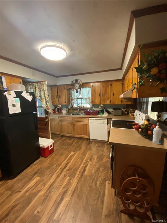 241 Nottoway Falls Road Kenbridge, VA 23944 - Photo 8 of 29 a kitchen with stainless steel appliances kitchen island granite countertop a refrigerator and a stove top oven