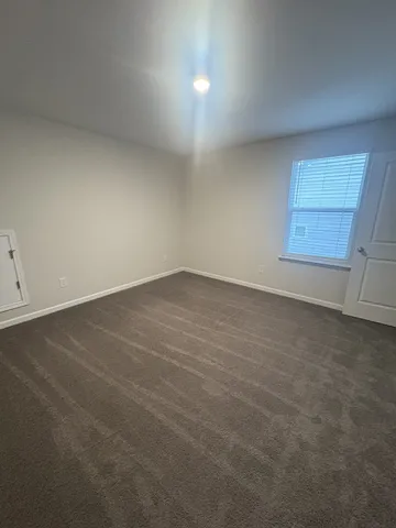 an empty room with a empty space and window