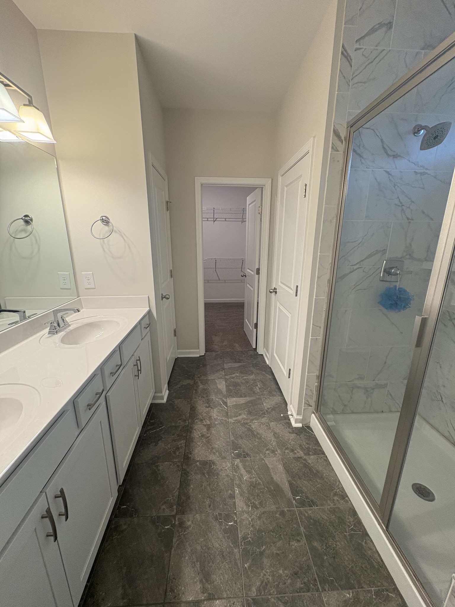 422 Butler Road Mount Juliet, TN 37122 - Photo 21 of 28 a spacious bathroom with a double vanity sink a mirror and a shower