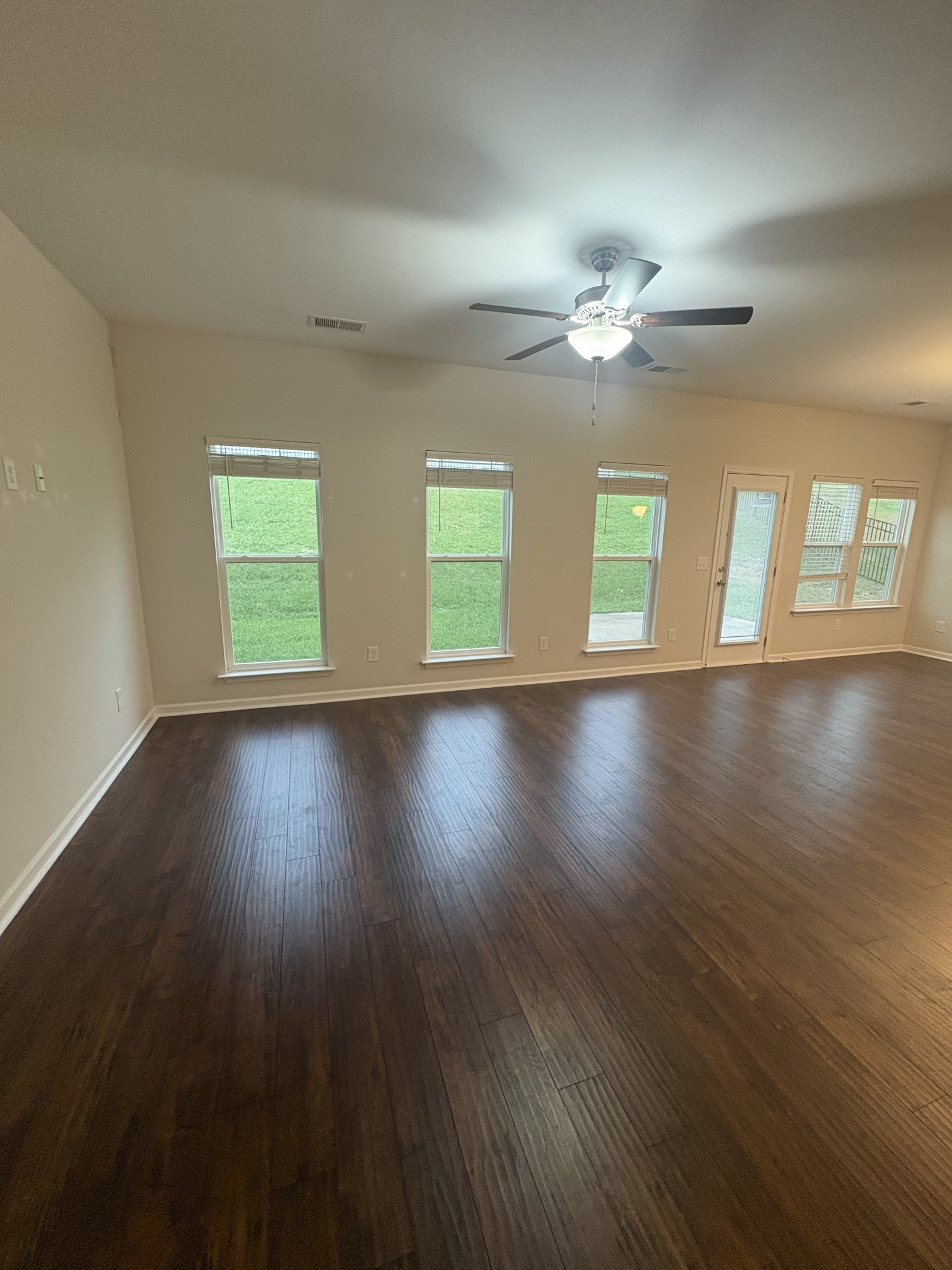 422 Butler Road Mount Juliet, TN 37122 - Photo 5 of 28 a view of an empty room with wooden floor and a window