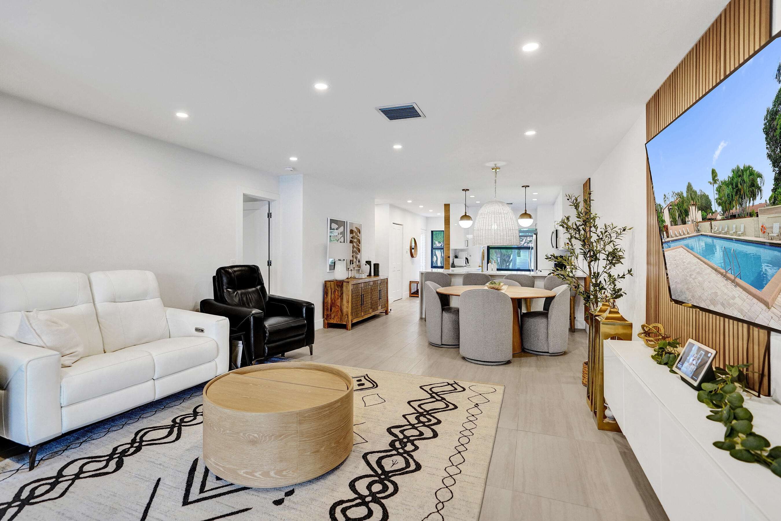9293 Vista Del Lago, Unit 15F Boca Raton, FL 33428 - Photo 12 of 42 a living room with furniture and a couch
