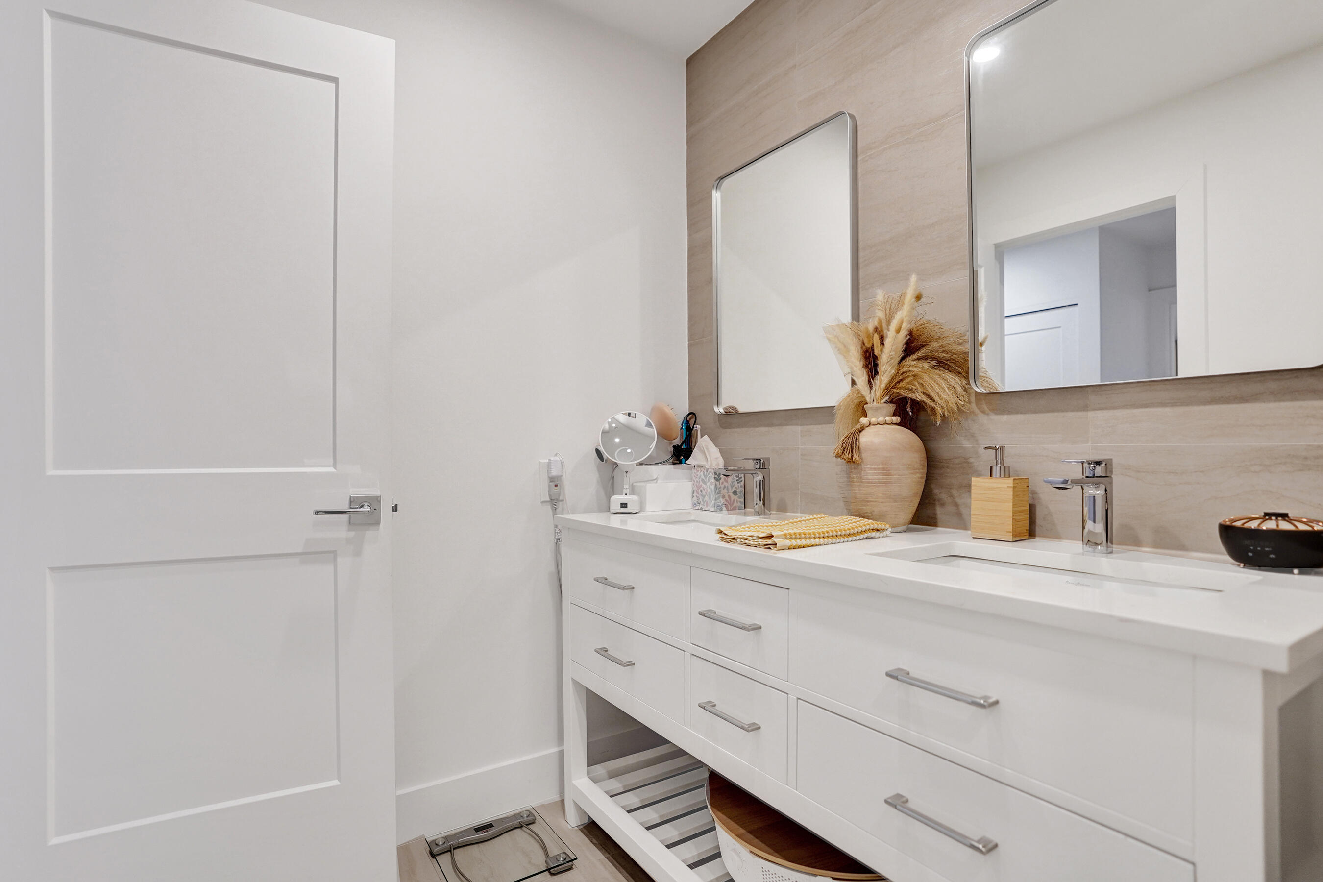 9293 Vista Del Lago, Unit 15F Boca Raton, FL 33428 - Photo 16 of 42 a bathroom with a sink and a mirror