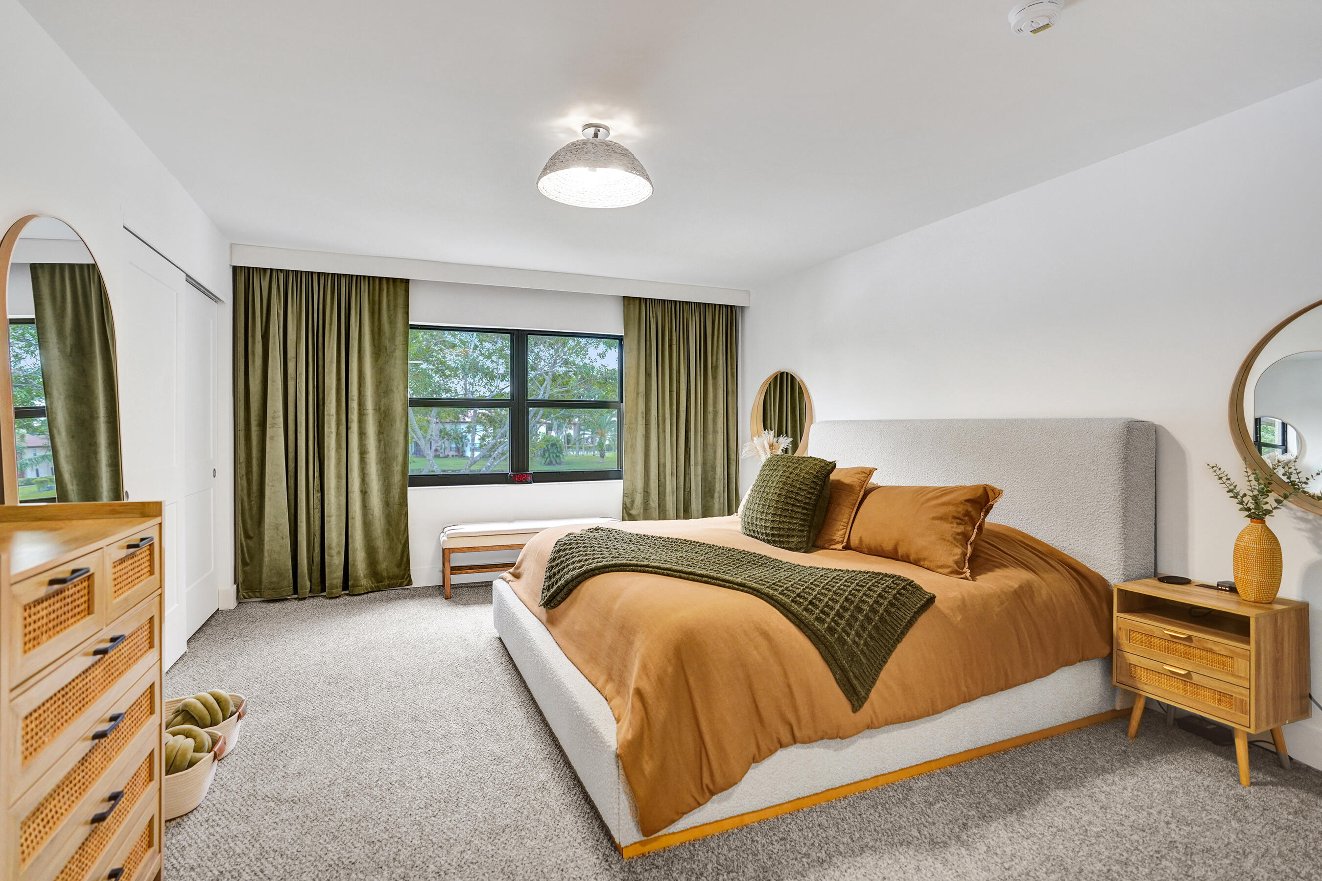 9293 Vista Del Lago, Unit 15F Boca Raton, FL 33428 - Photo 18 of 42 a bedroom with a bed and a dresser