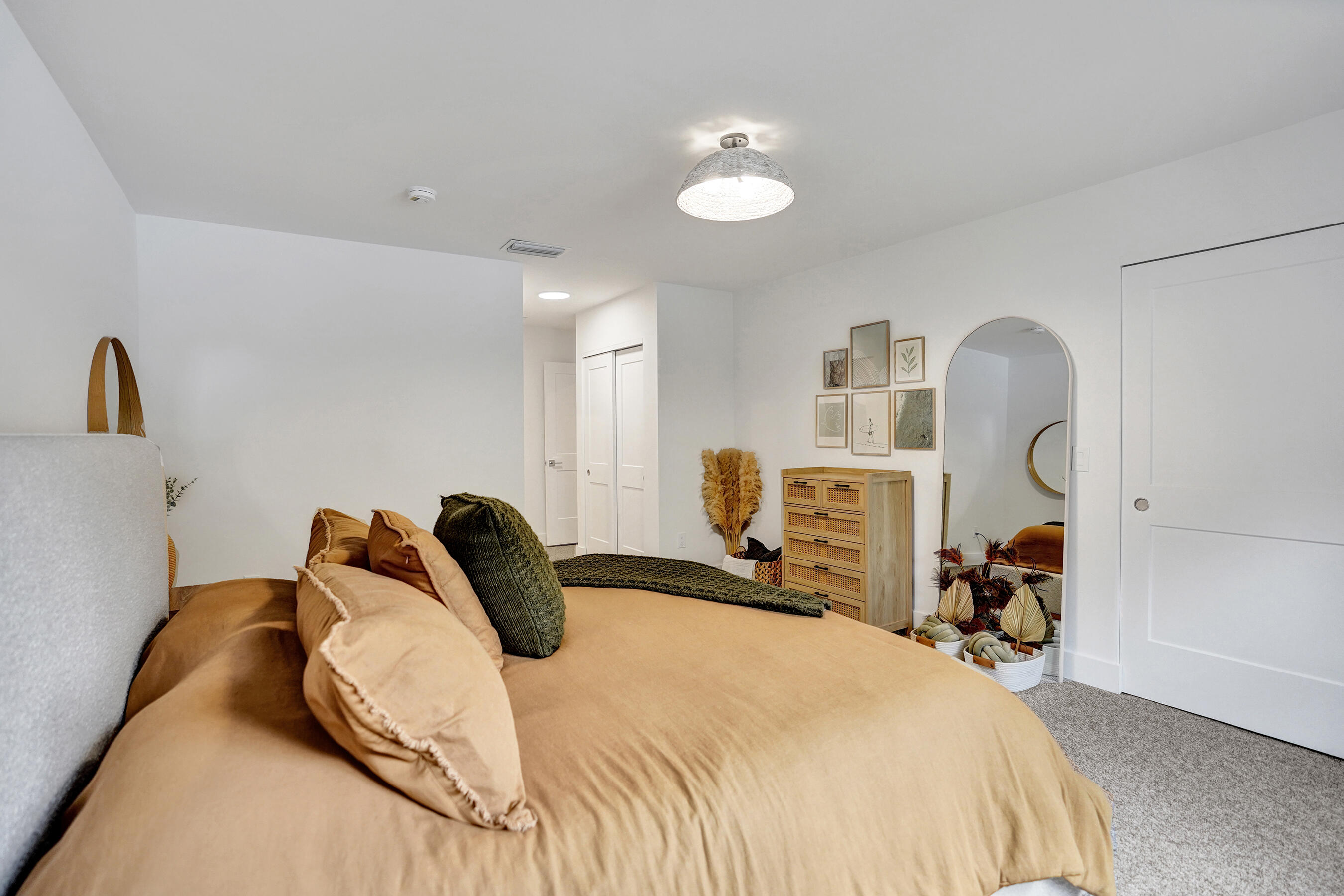 9293 Vista Del Lago, Unit 15F Boca Raton, FL 33428 - Photo 19 of 42 a bedroom with a bed and a large mirror