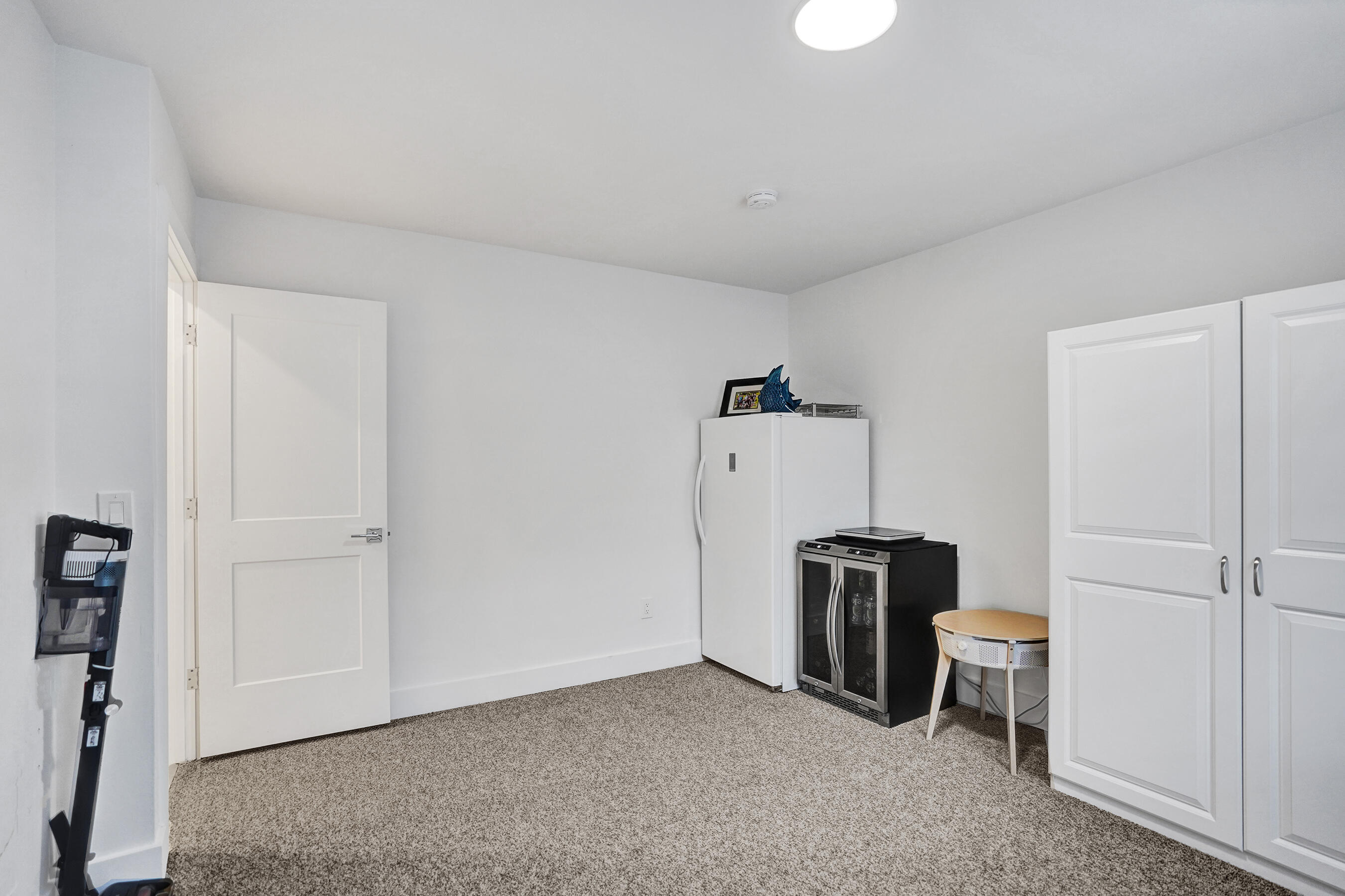 9293 Vista Del Lago, Unit 15F Boca Raton, FL 33428 - Photo 22 of 42 a view of a storage & utility room with refrigerator