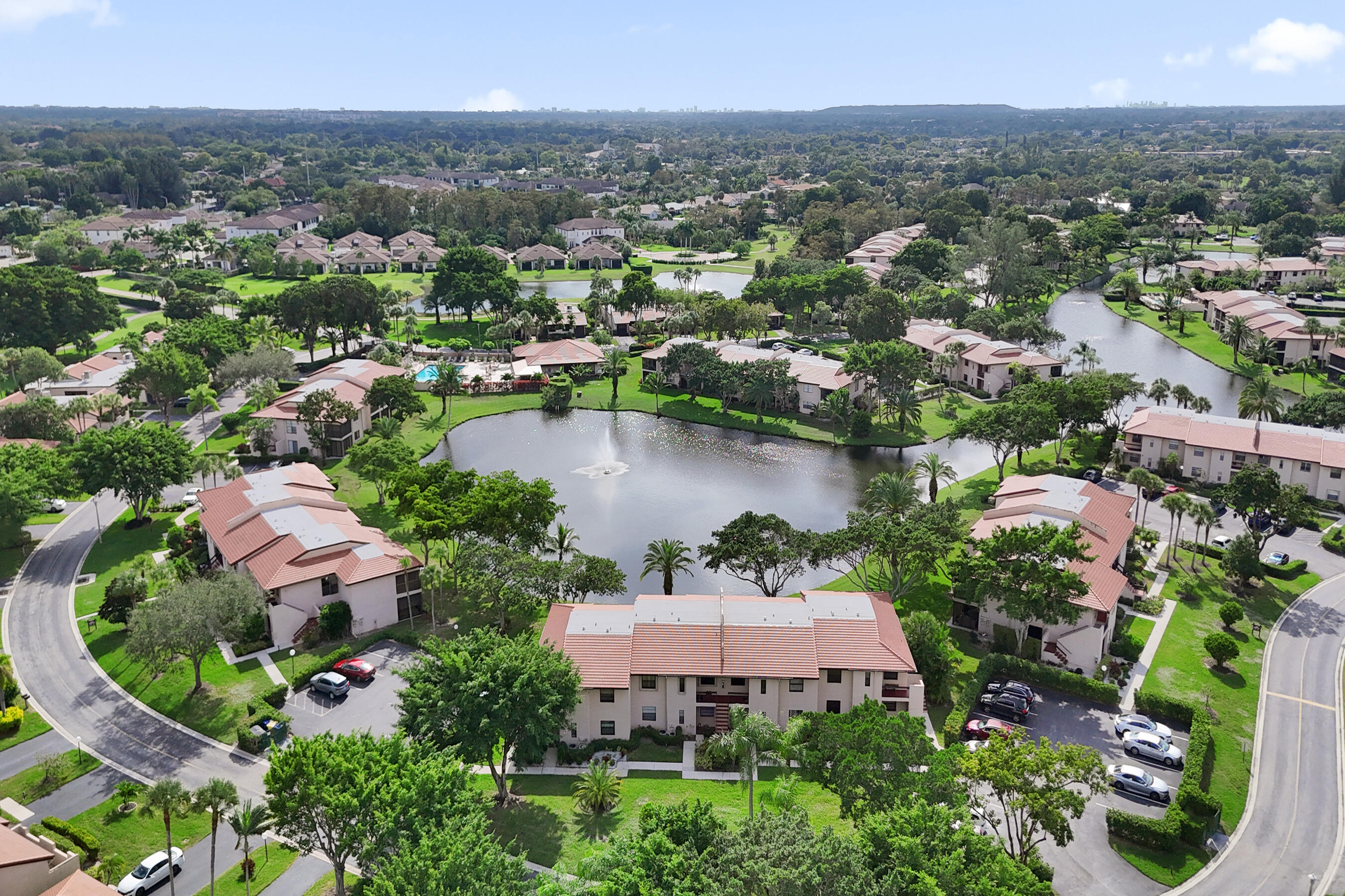 9293 Vista Del Lago, Unit 15F Boca Raton, FL 33428 - Photo 29 of 42 an aerial view of a houses with outdoor space and lake view