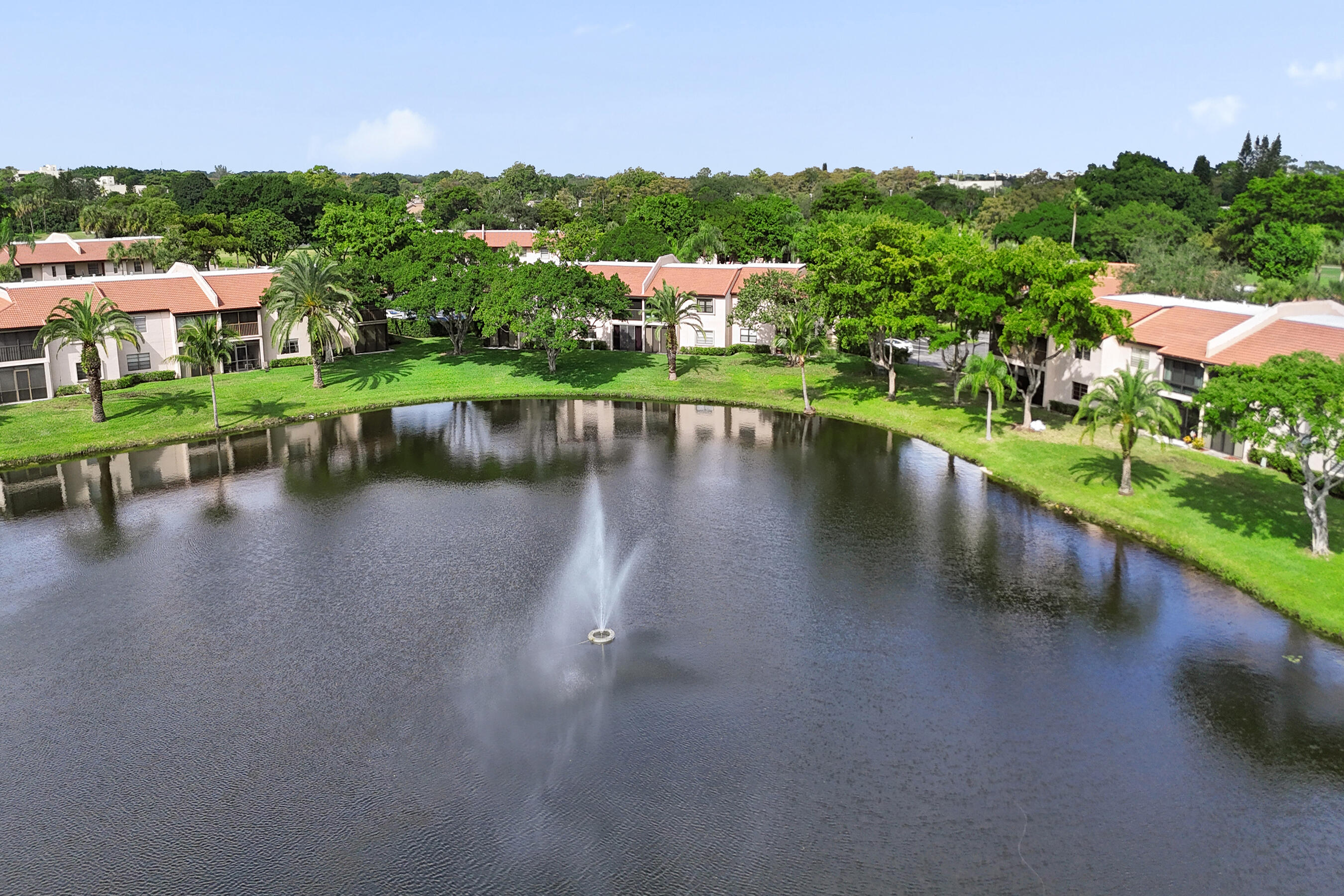9293 Vista Del Lago, Unit 15F Boca Raton, FL 33428 - Photo 31 of 42 a view of a lake with a city from a lake view