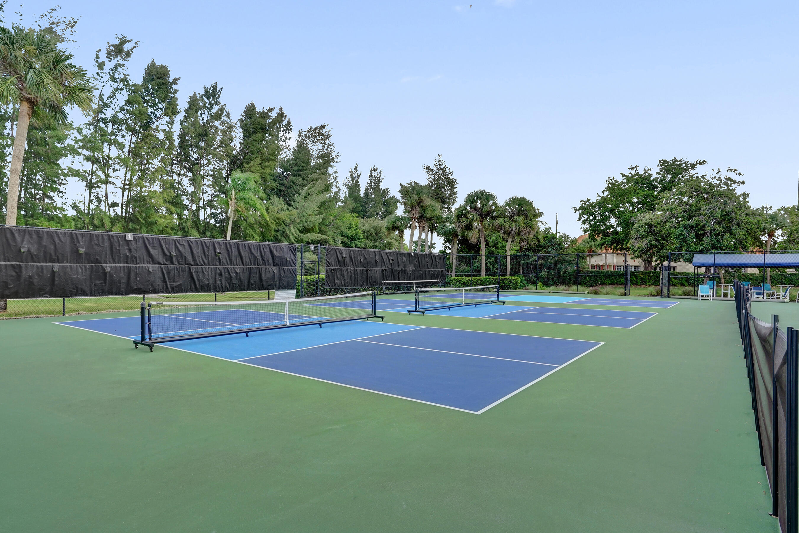 9293 Vista Del Lago, Unit 15F Boca Raton, FL 33428 - Photo 34 of 42 a view of a tennis court