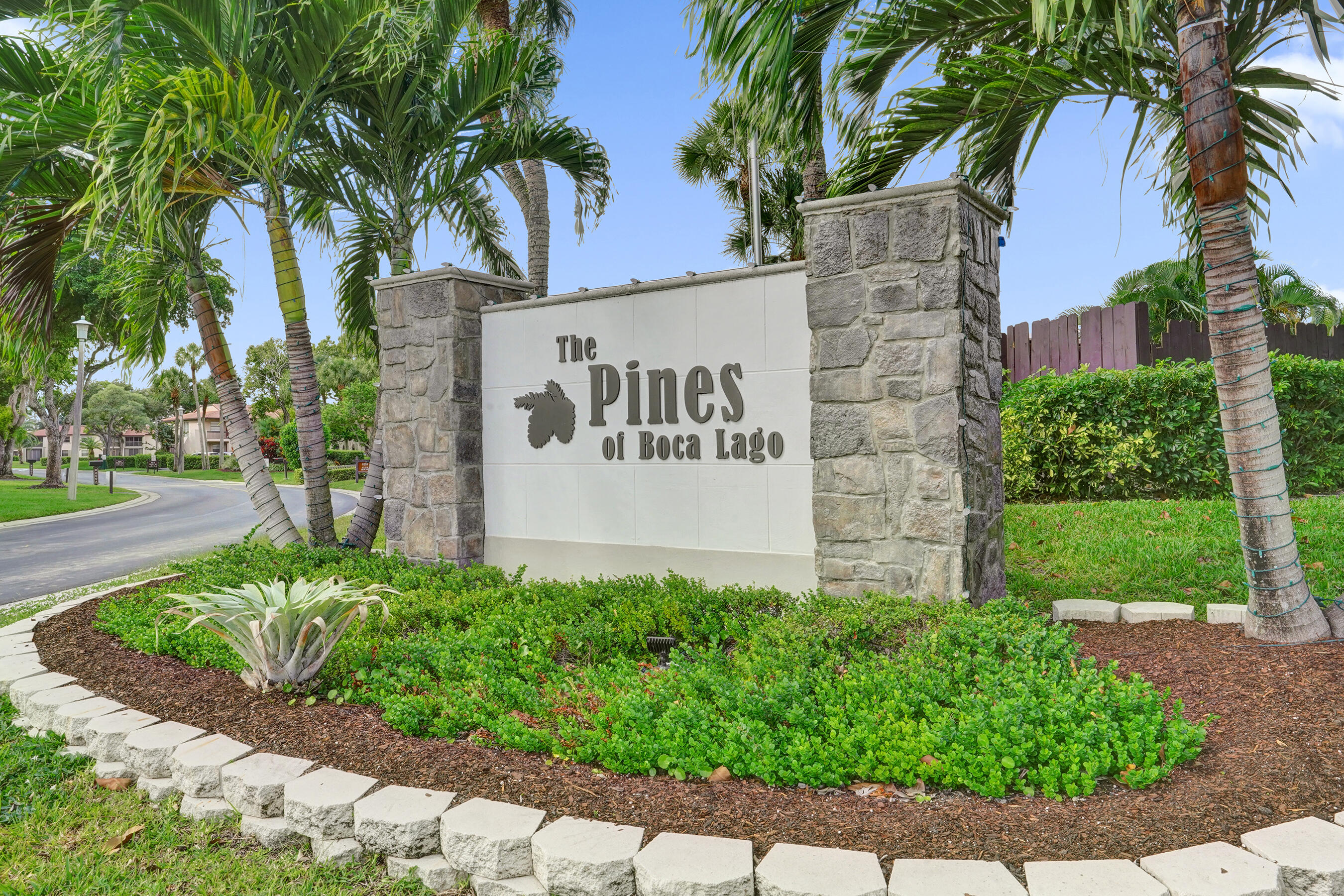9293 Vista Del Lago, Unit 15F Boca Raton, FL 33428 - Photo 35 of 42 a sign on the side of a building