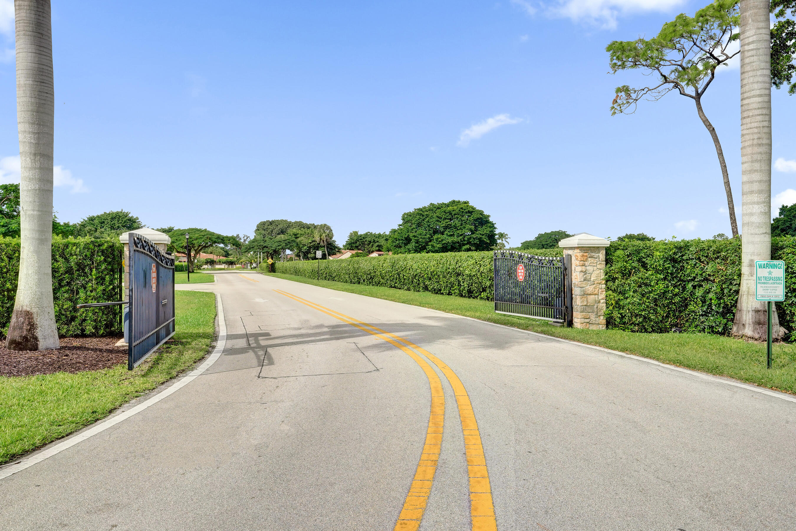 9293 Vista Del Lago, Unit 15F Boca Raton, FL 33428 - Photo 36 of 42 a view of a street with a park
