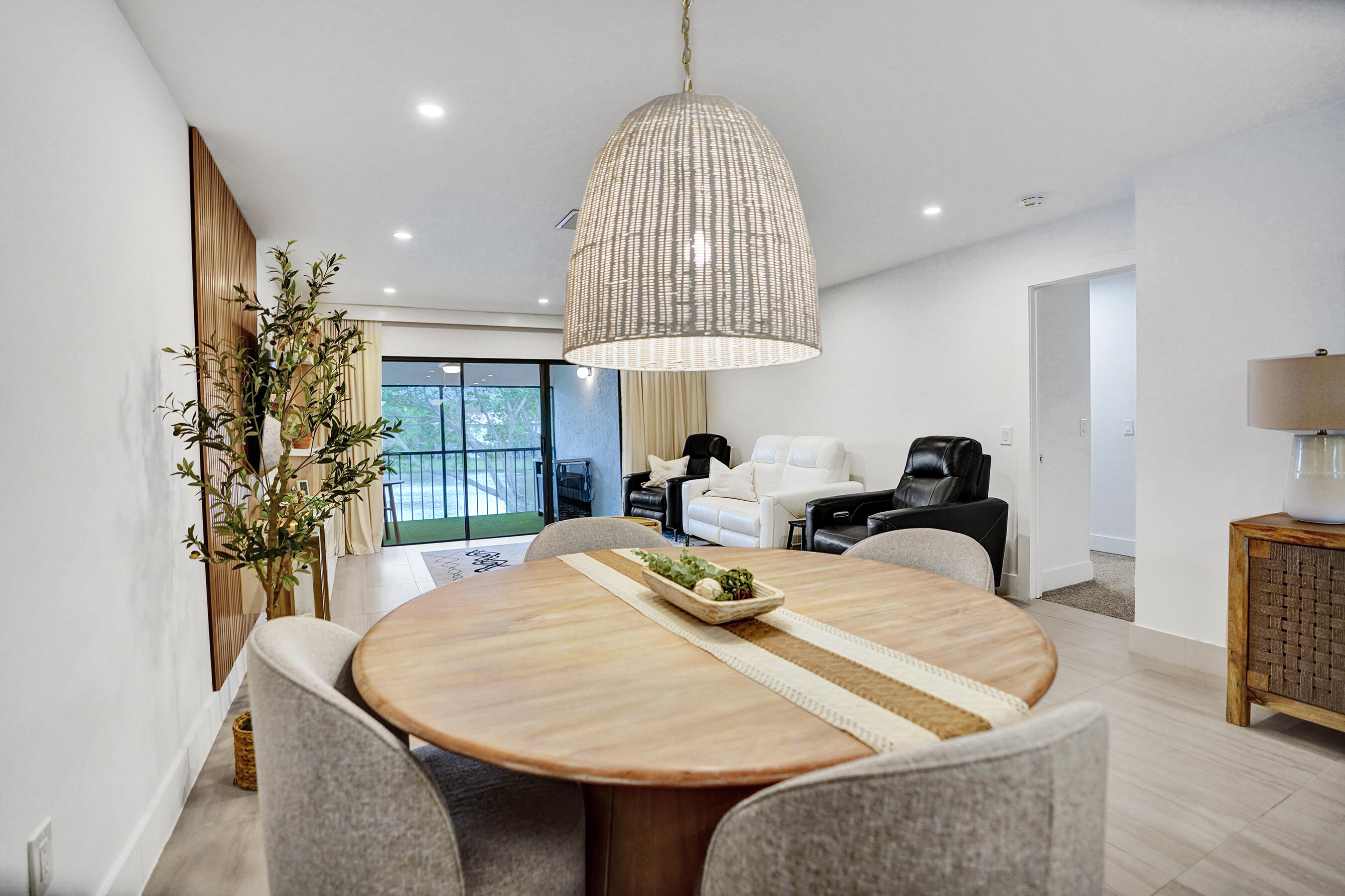 9293 Vista Del Lago, Unit 15F Boca Raton, FL 33428 - Photo 7 of 42 a view of a dining room with furniture