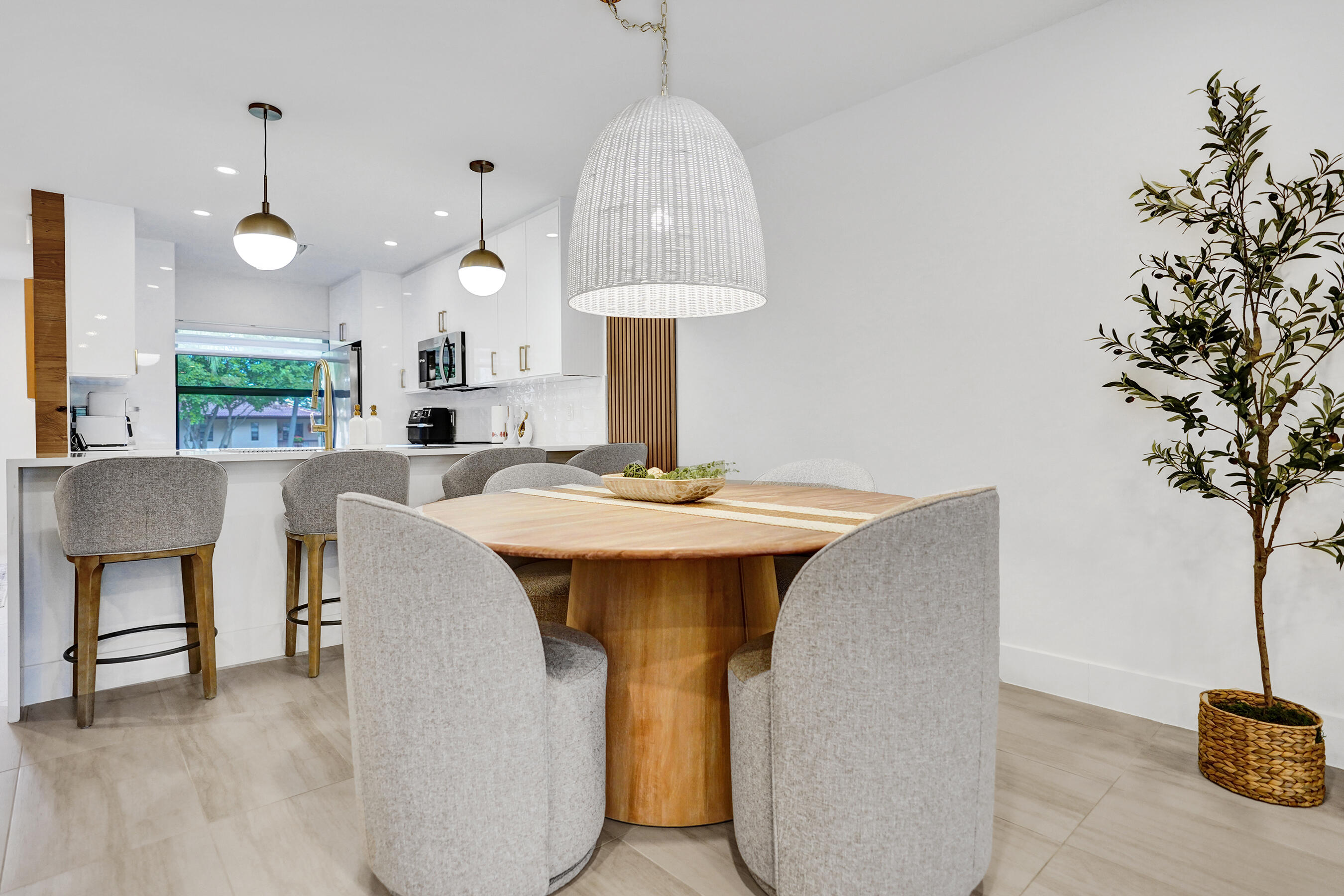 9293 Vista Del Lago, Unit 15F Boca Raton, FL 33428 - Photo 8 of 42 a kitchen with a sink and a table