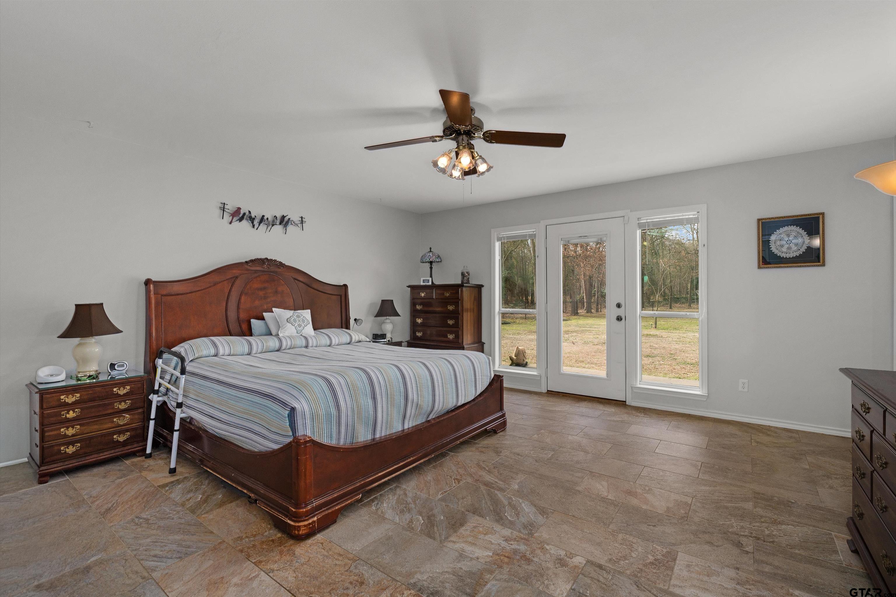 20 County Road 2938 South Pittsburg, TX 75686 - Photo 14 of 27 a bedroom with a bed and window