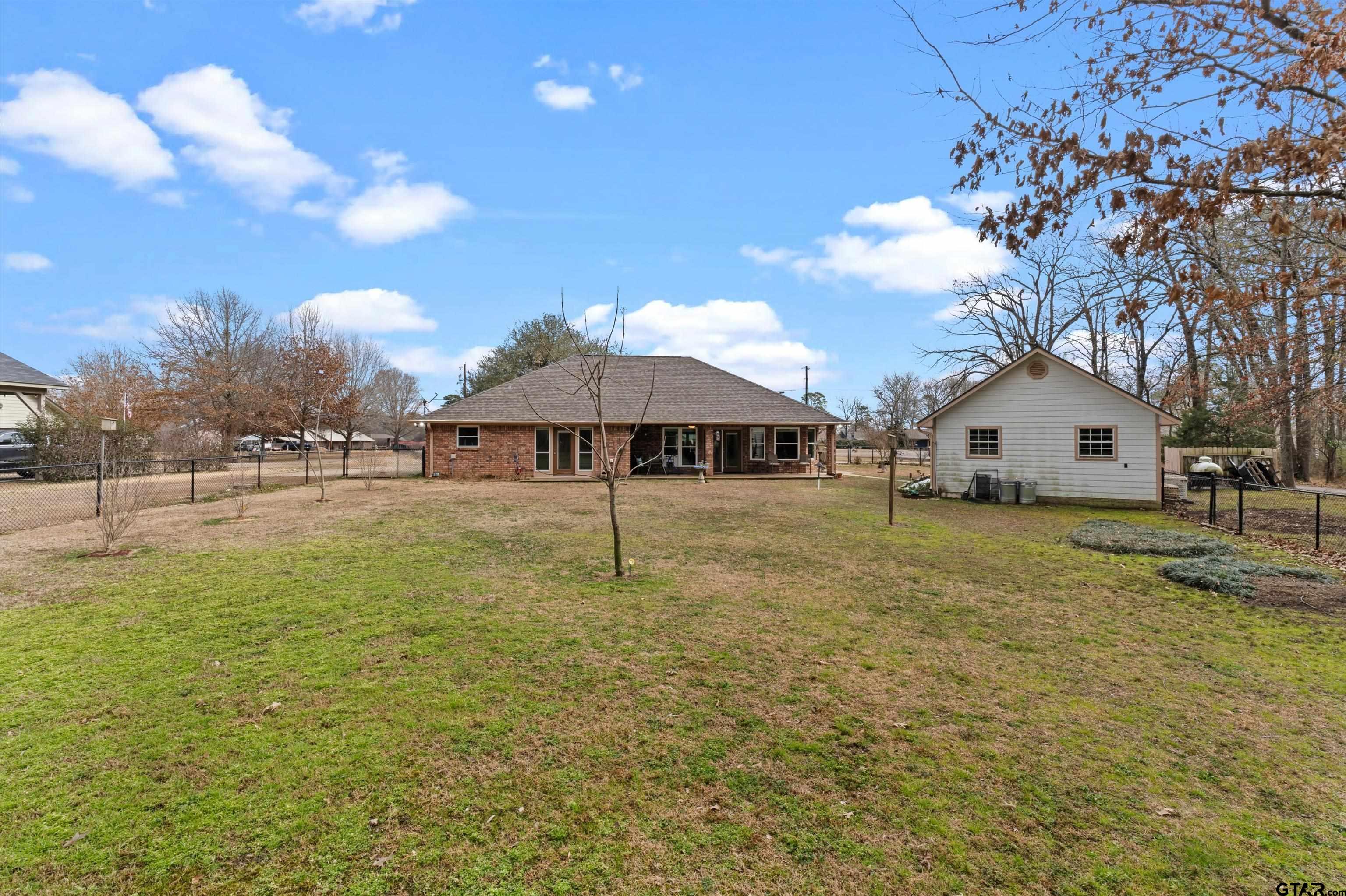 20 County Road 2938 South Pittsburg, TX 75686 - Photo 23 of 27 a backyard of a house with table and chairs