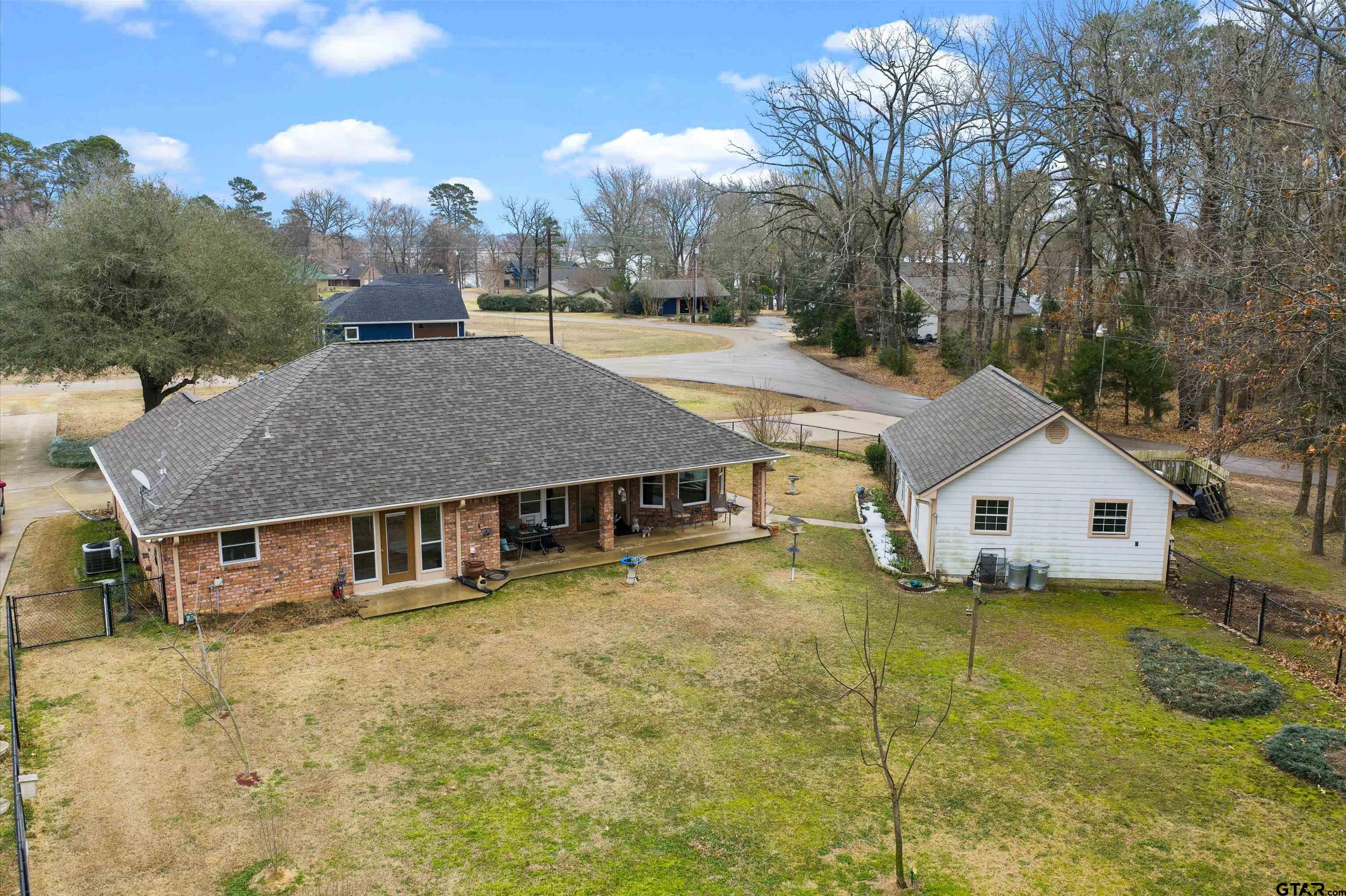 20 County Road 2938 South Pittsburg, TX 75686 - Photo 24 of 27 a view of a house with a yard patio and deck