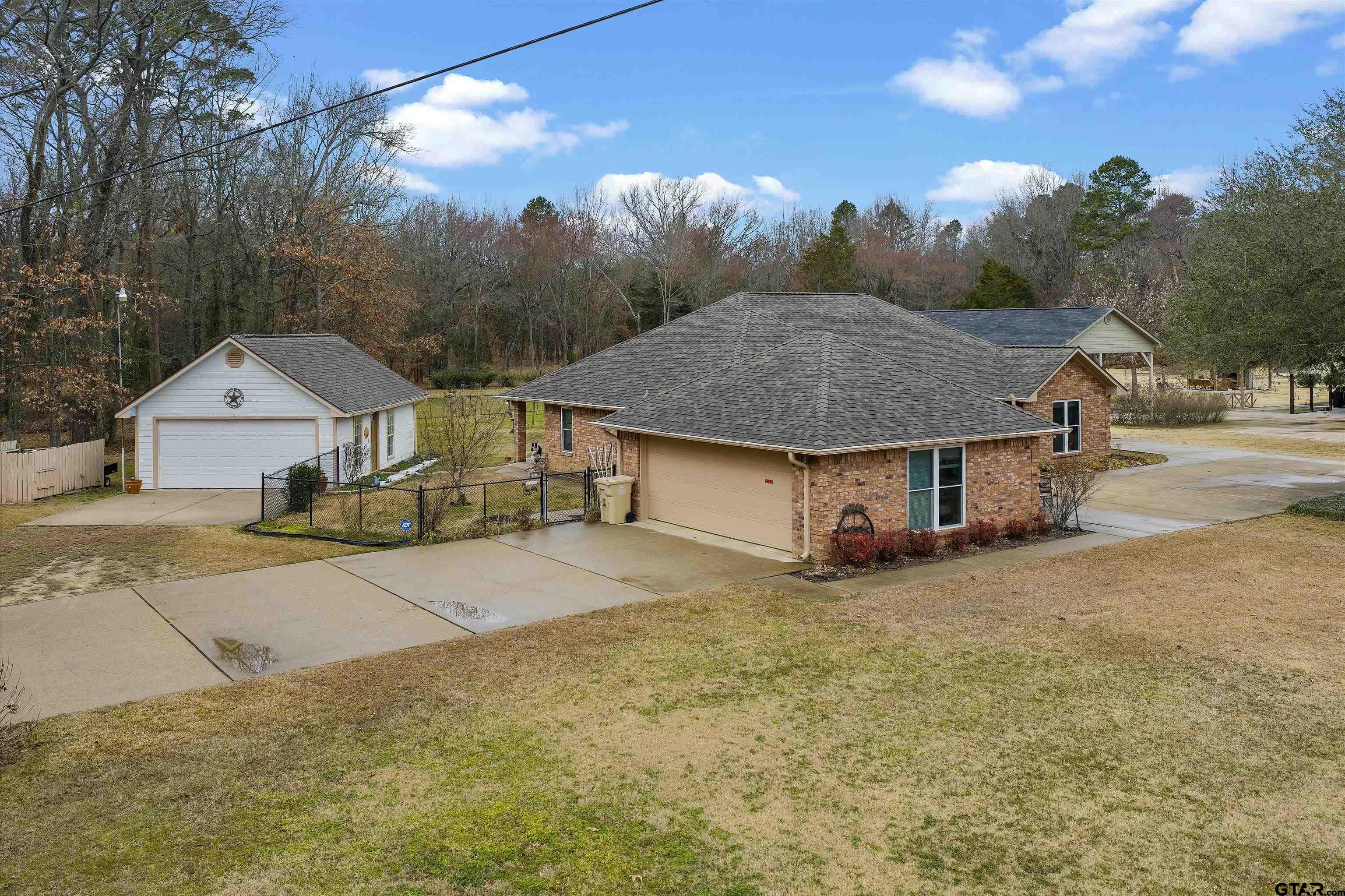 20 County Road 2938 South Pittsburg, TX 75686 - Photo 25 of 27 a view of a house with backyard and trees