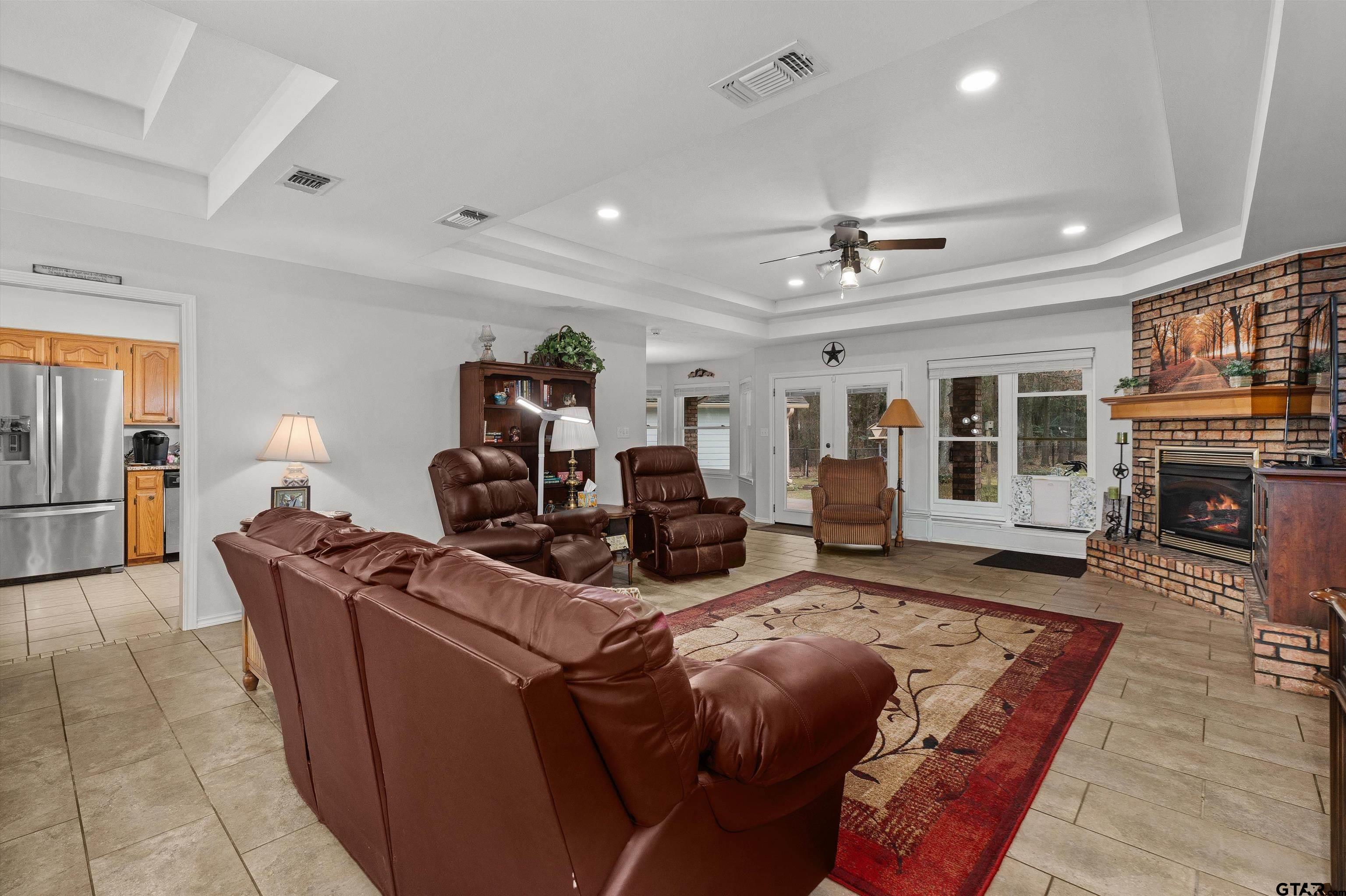 20 County Road 2938 South Pittsburg, TX 75686 - Photo 5 of 27 a living room with furniture and a fireplace