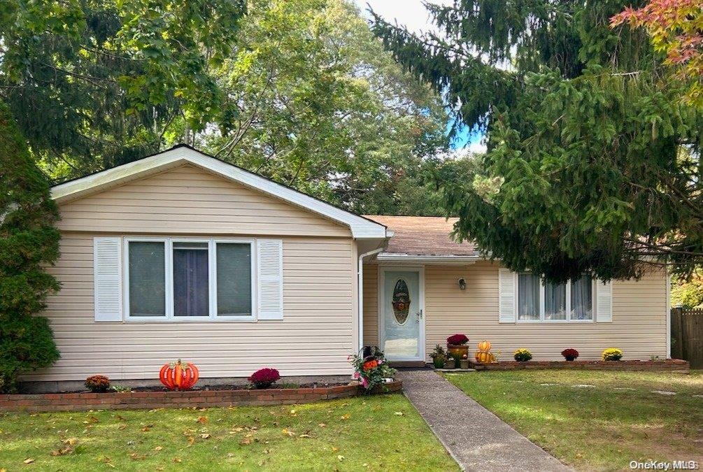 18 Highview Lane Ridge, NY 11961 - Photo 1 of 1 a view of a white house with a yard