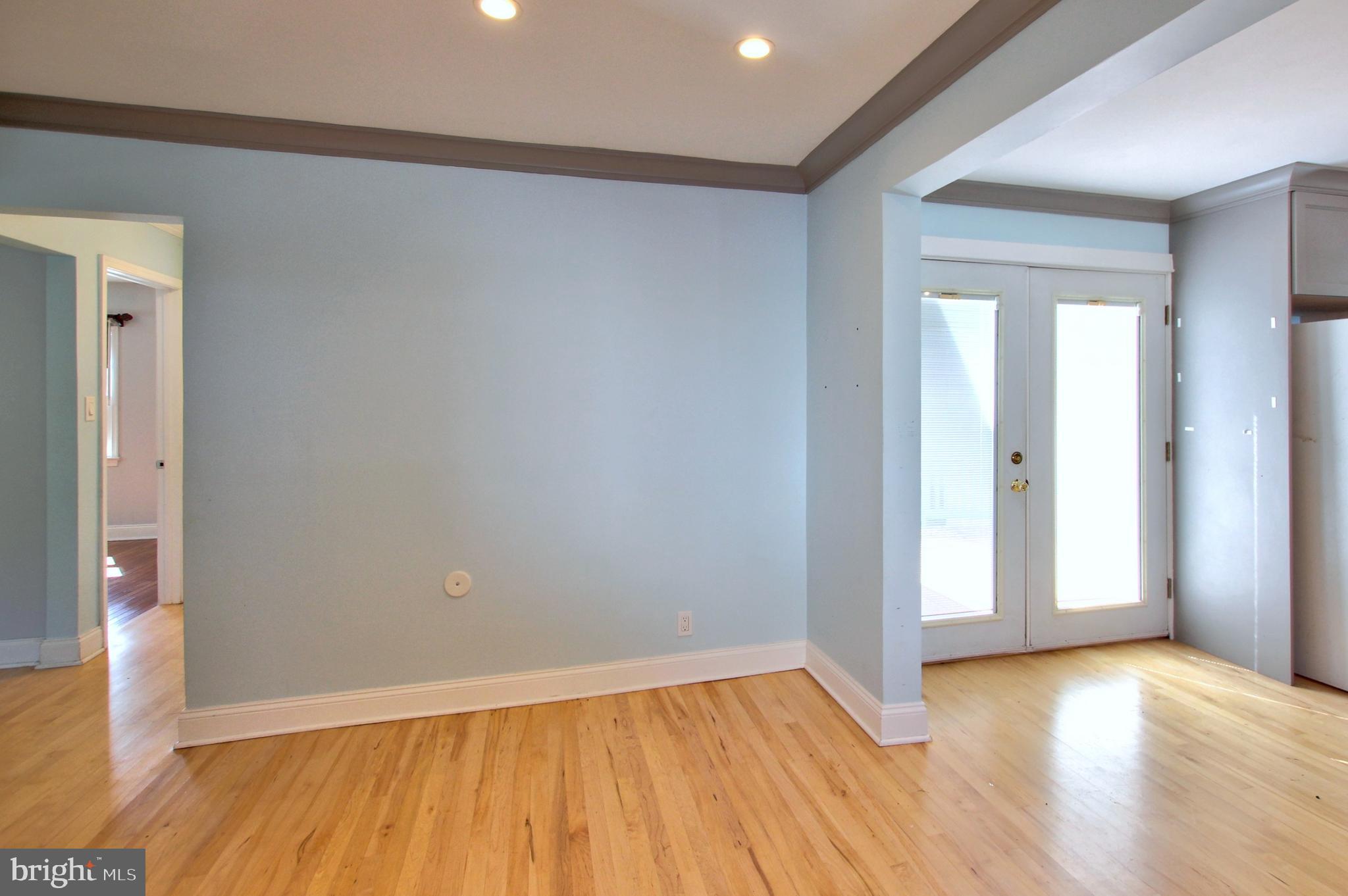 11808 Goodloe Road Silver Spring, MD 20906 - Photo 11 of 57 wooden floor in an empty room with a window