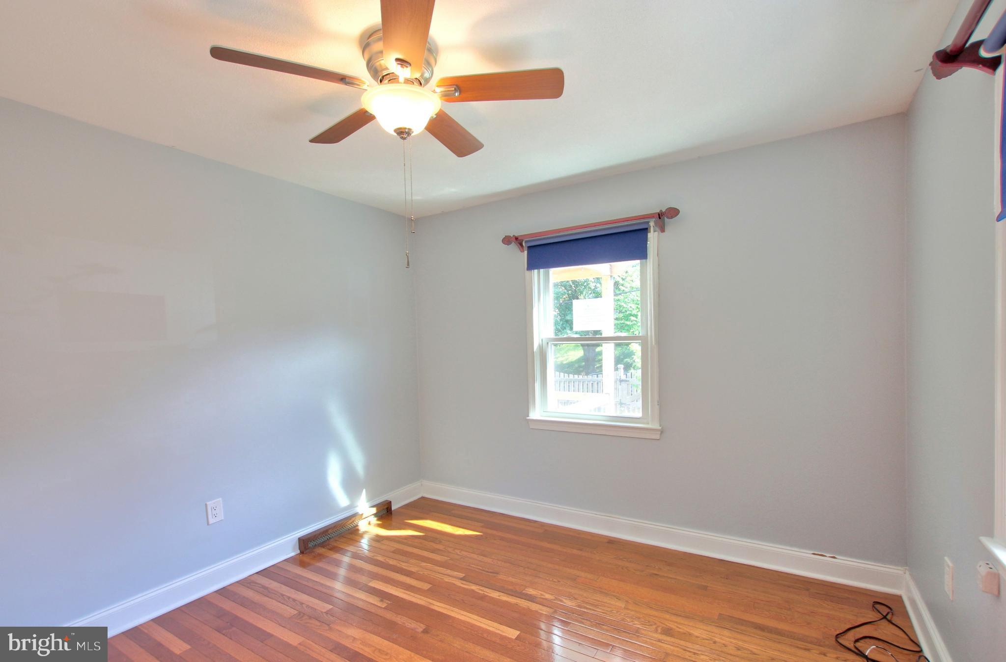 11808 Goodloe Road Silver Spring, MD 20906 - Photo 24 of 57 wooden floor in an empty room with a window