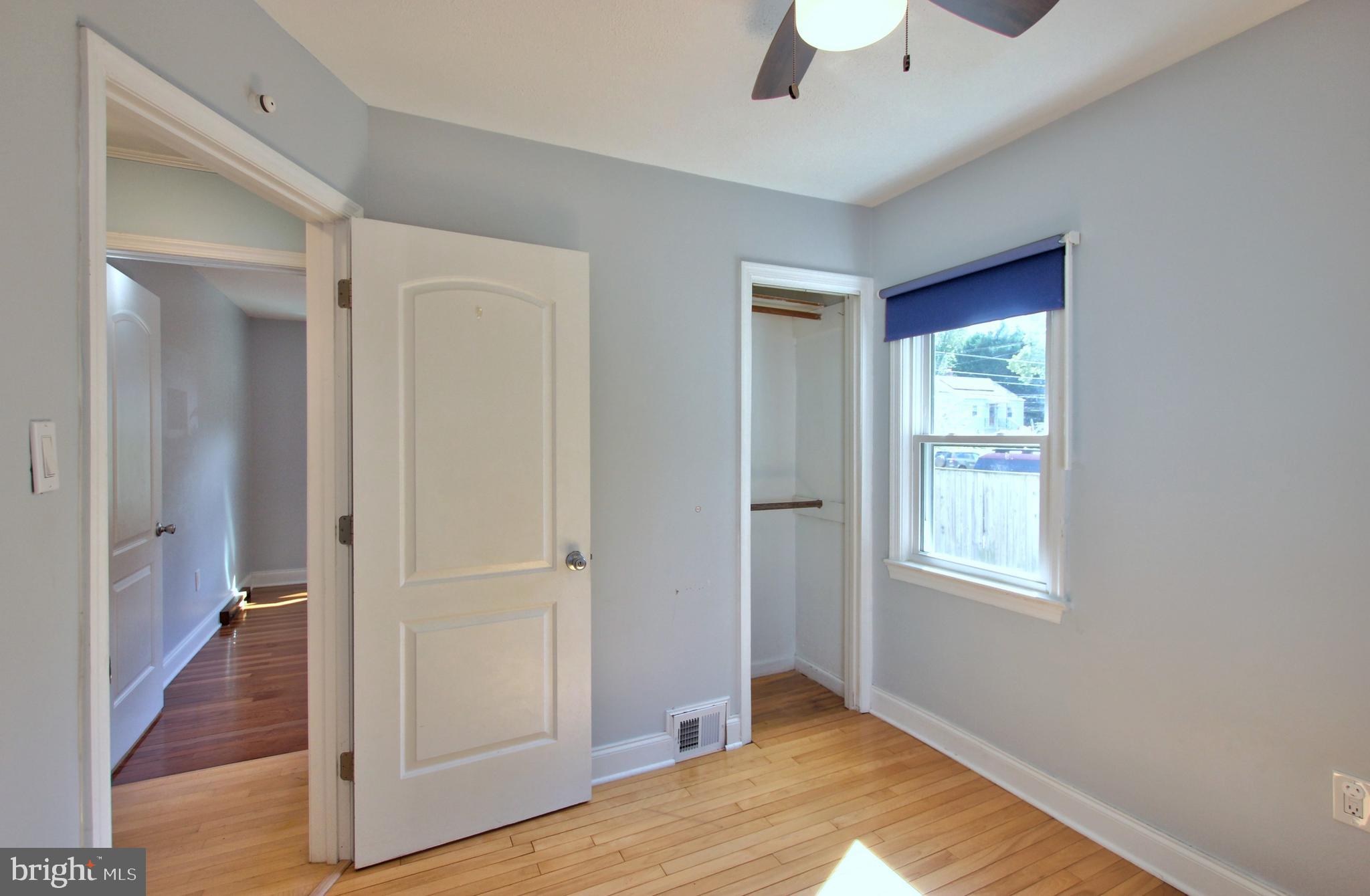 11808 Goodloe Road Silver Spring, MD 20906 - Photo 27 of 57 a view of an empty room with window and wooden floor