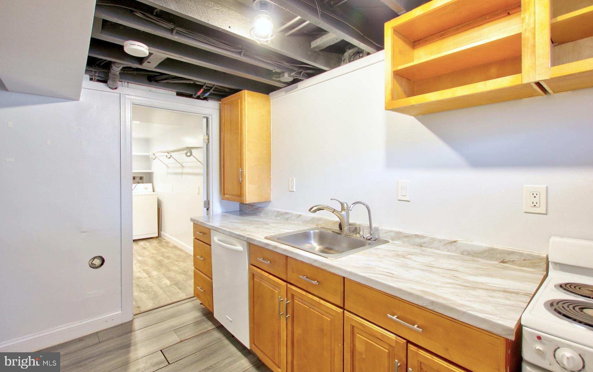 11808 Goodloe Road Silver Spring, MD 20906 - Photo 35 of 57 a bathroom with a granite countertop sink and a mirror