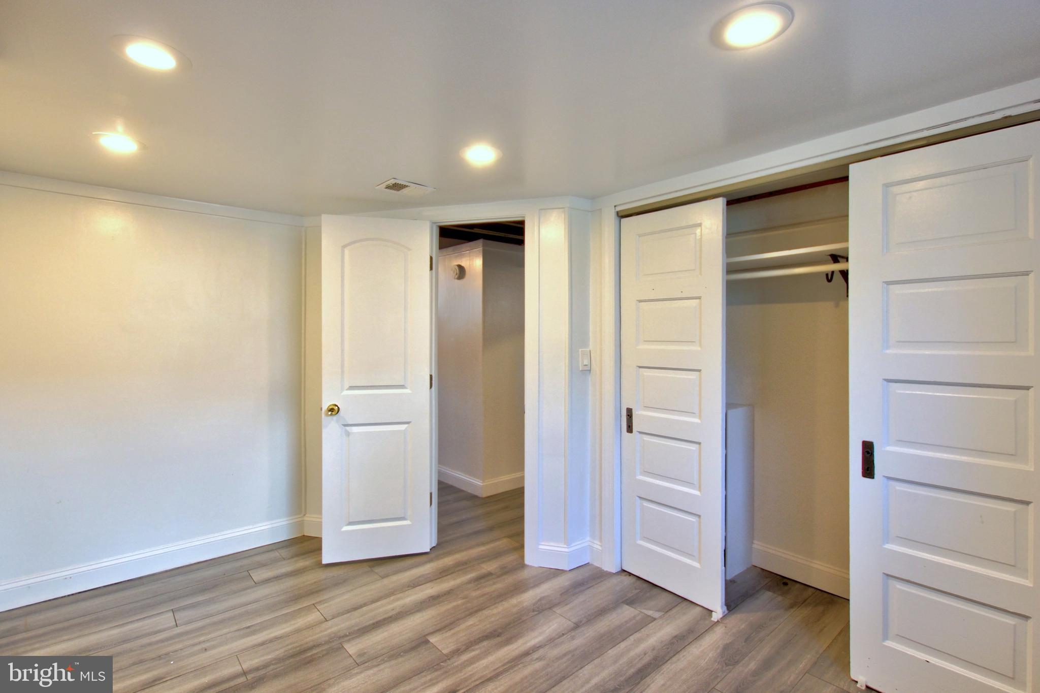 11808 Goodloe Road Silver Spring, MD 20906 - Photo 39 of 57 a view of an empty room with wooden floor and closet