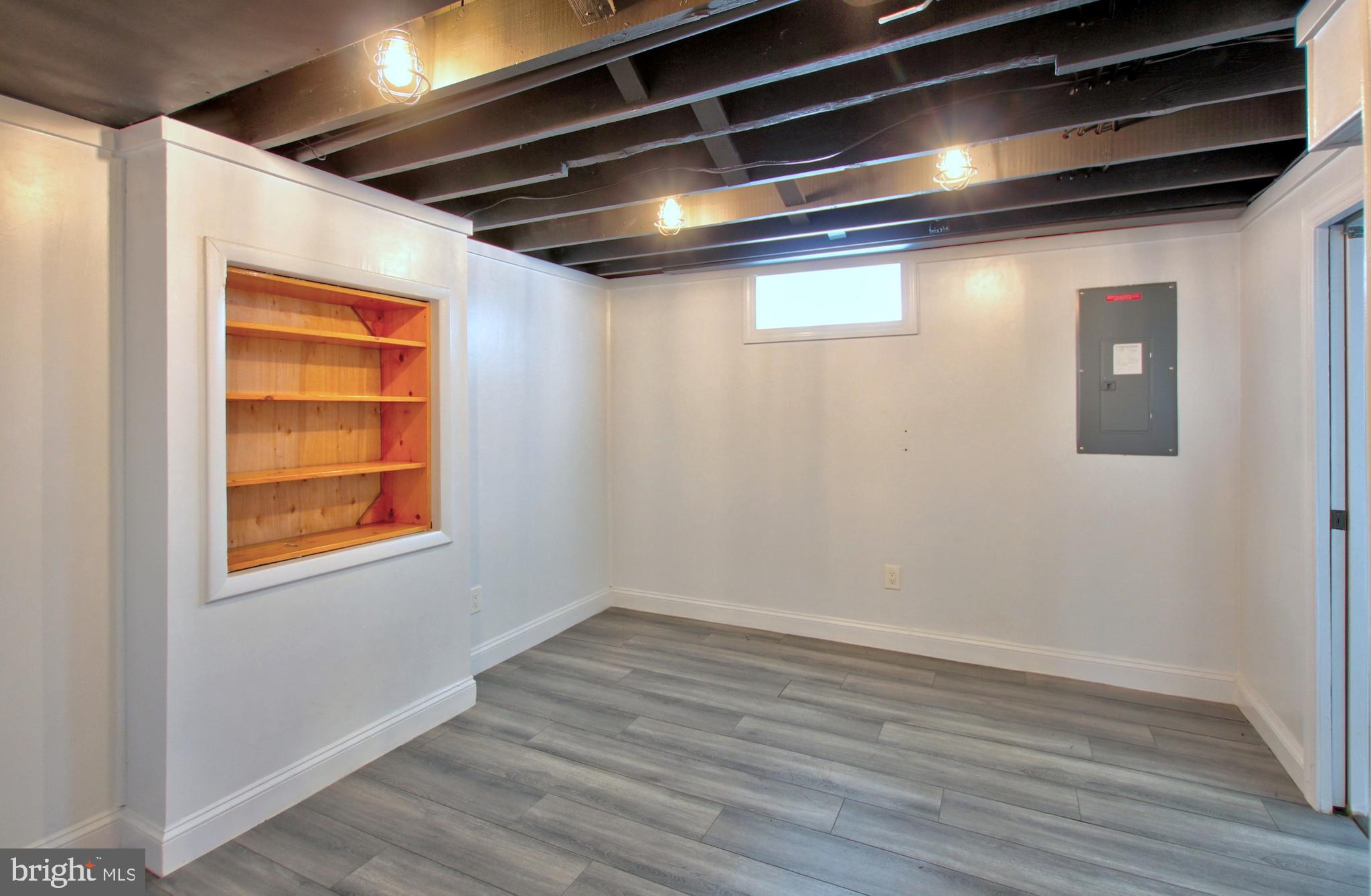 11808 Goodloe Road Silver Spring, MD 20906 - Photo 42 of 57 a view of an empty room with wooden floor and a window