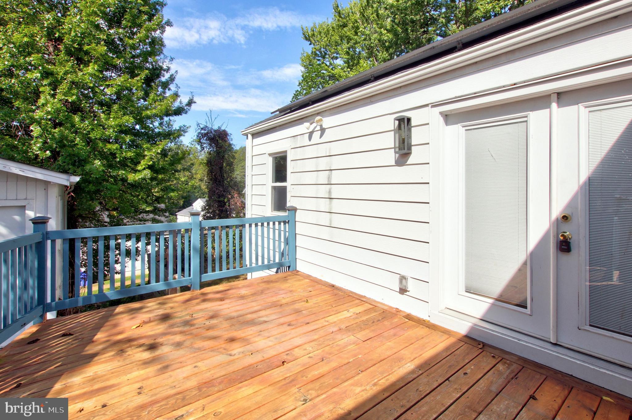 11808 Goodloe Road Silver Spring, MD 20906 - Photo 52 of 57 a view of a balcony with wooden floor and fence