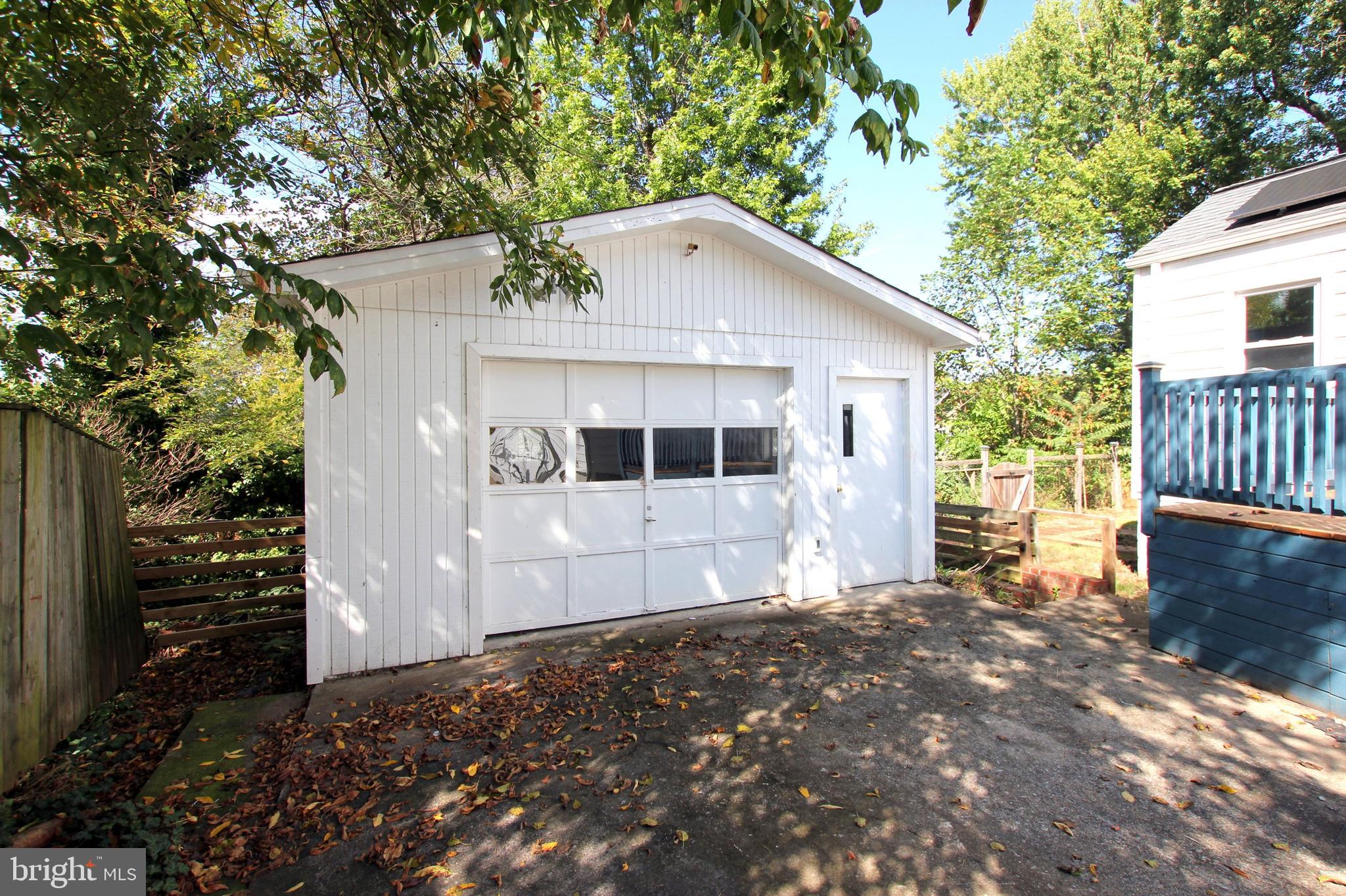 11808 Goodloe Road Silver Spring, MD 20906 - Photo 56 of 57 a front view of a house with garden