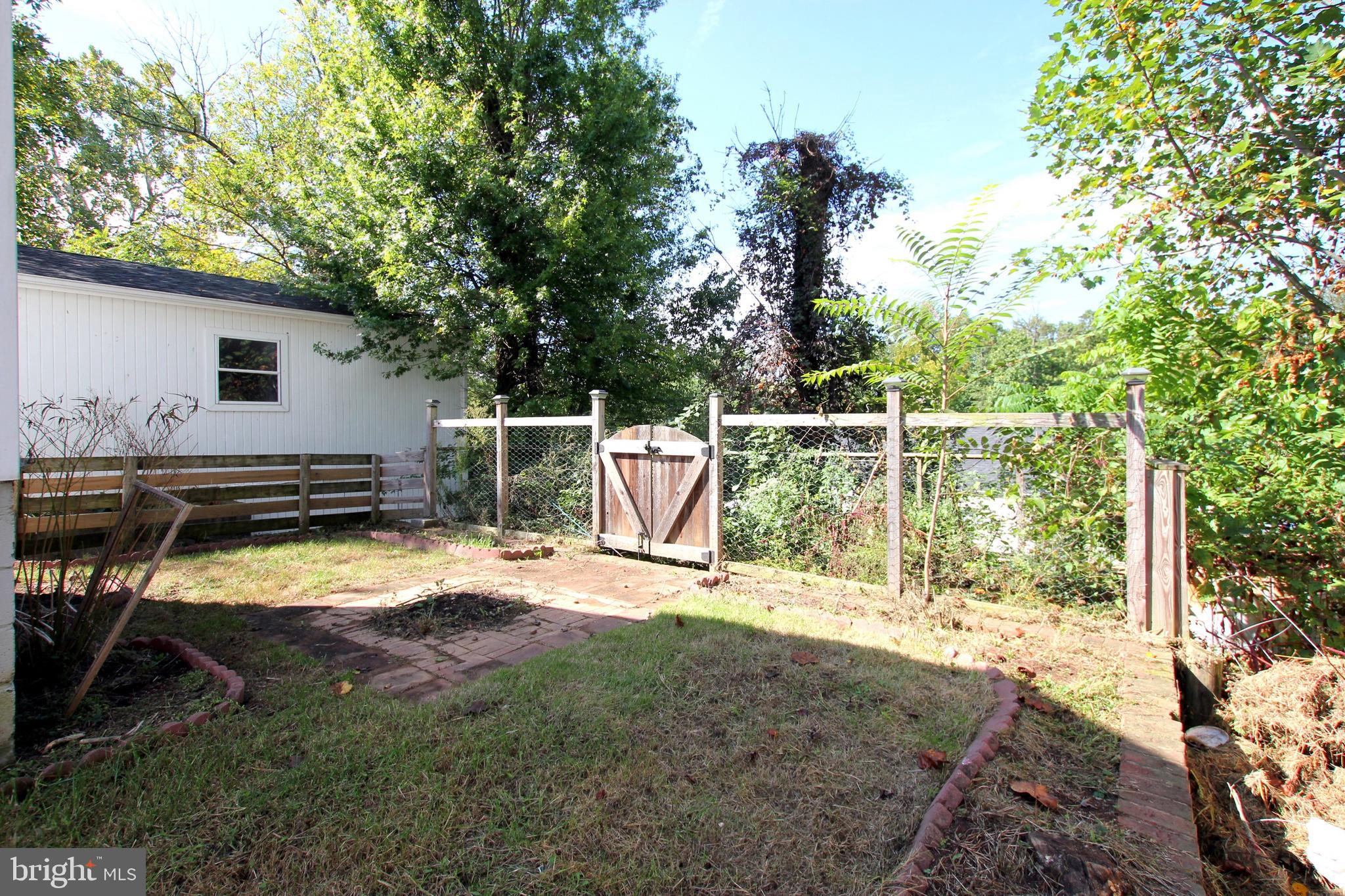 11808 Goodloe Road Silver Spring, MD 20906 - Photo 57 of 57 a view of backyard with slide and a trees