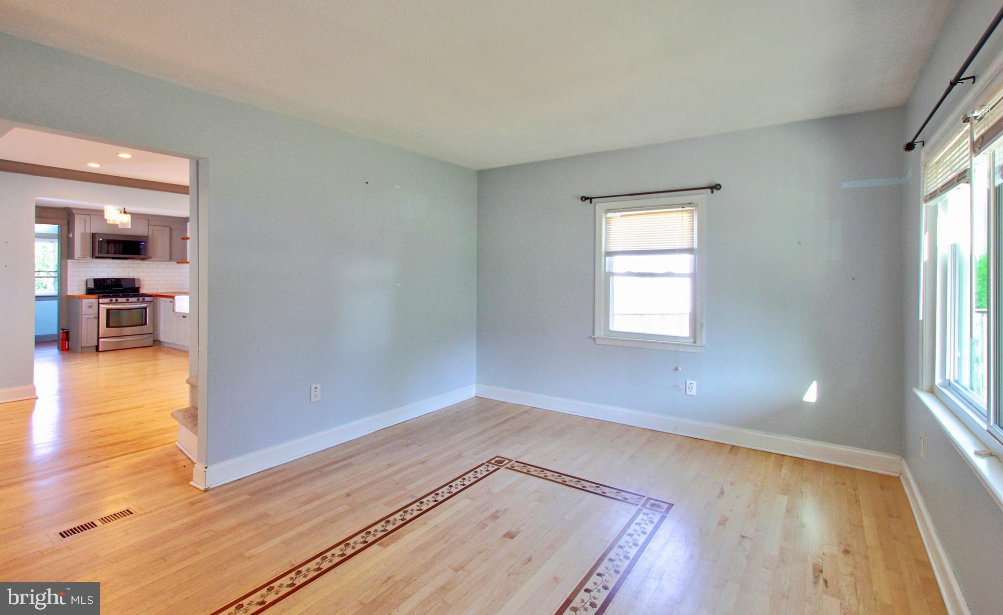 11808 Goodloe Road Silver Spring, MD 20906 - Photo 9 of 57 wooden floor in an empty room with a window