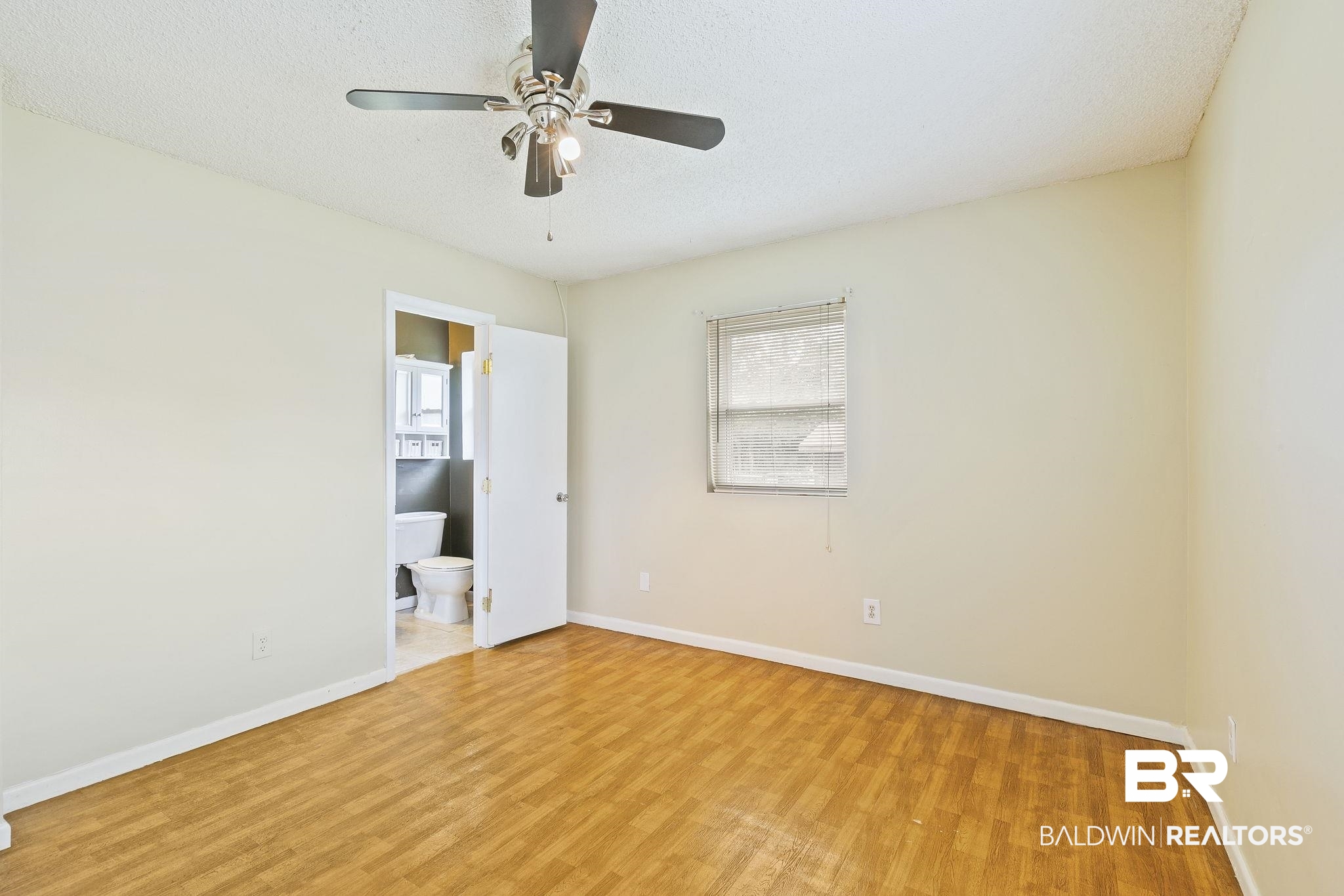 13108 6th Street Lillian, AL 36549 - Photo 24 of 39 Spare room with light hardwood / wood-style flooring, a textured ceiling, and ceiling fan